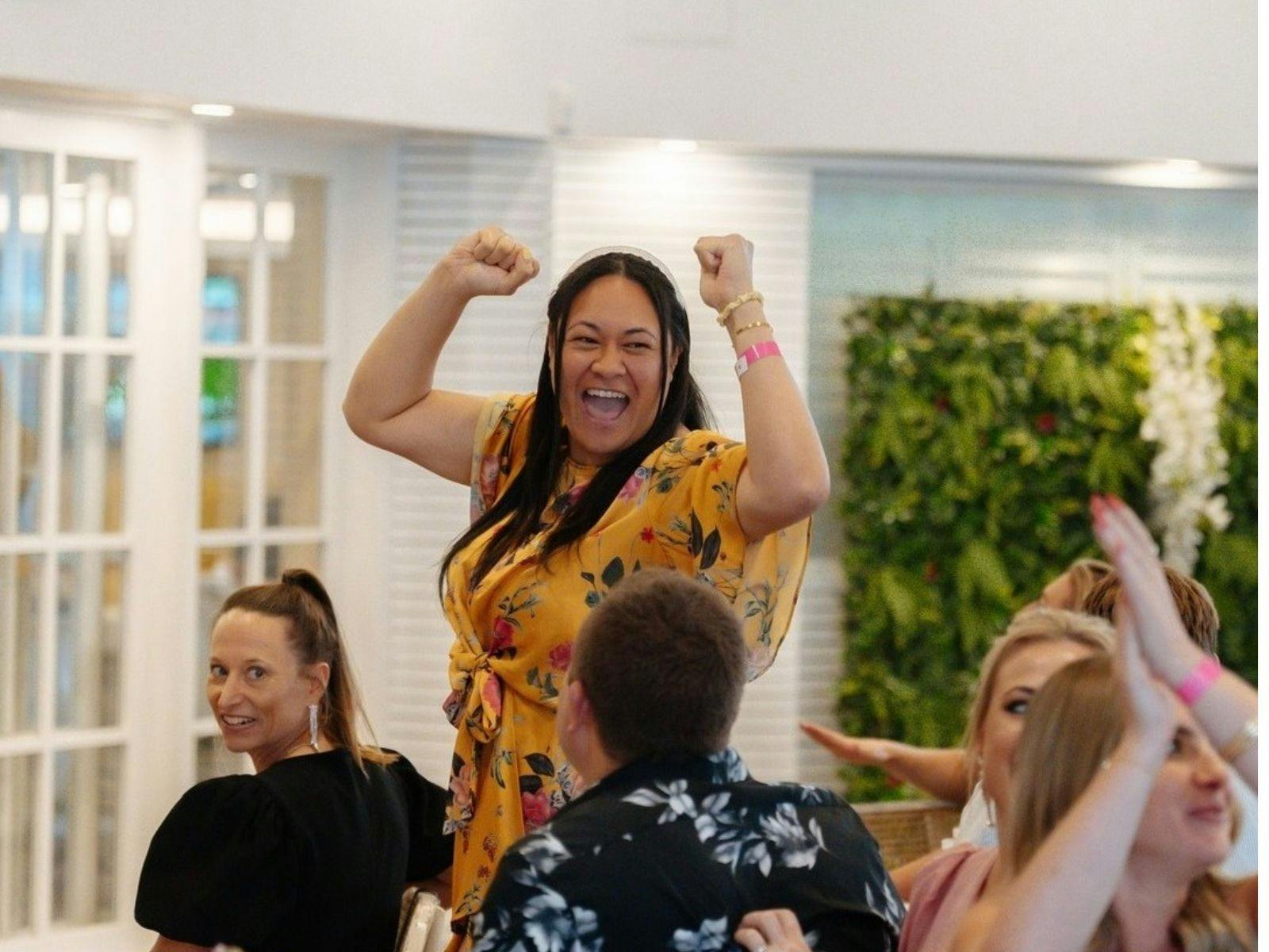 Woman celebrating during Melbourne Cup at Towradgi Beach Hotel.