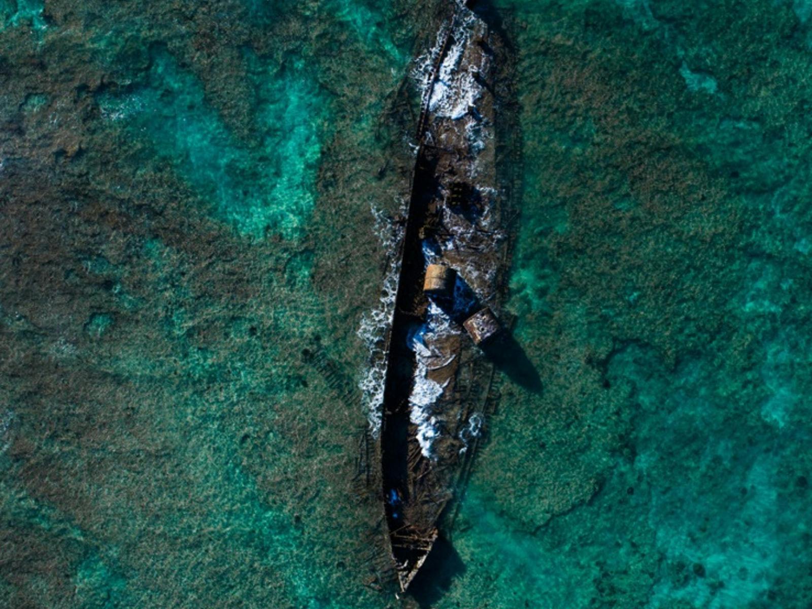 Aerial view of the Mildura Wreck in shallow turquoise waters off the Ningaloo Coast.