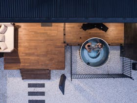 Couple in the hot tub with their local Coonawarra wine.