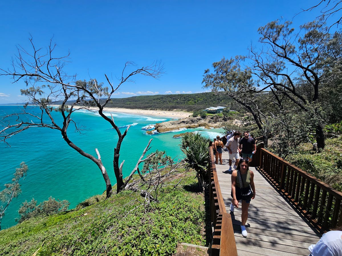 Scenic boardwalk walk with guests overlooking the ocean at Point Lookout, Stradbroke Island – a high