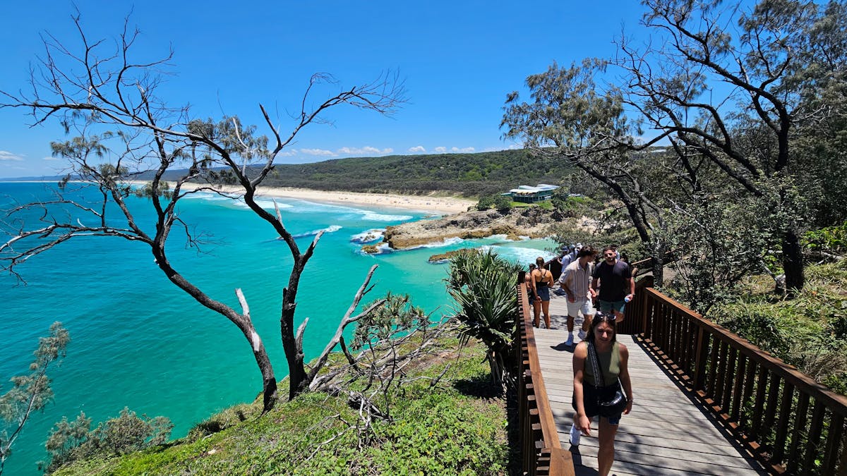 Scenic boardwalk walk with guests overlooking the ocean at Point Lookout, Stradbroke Island – a high