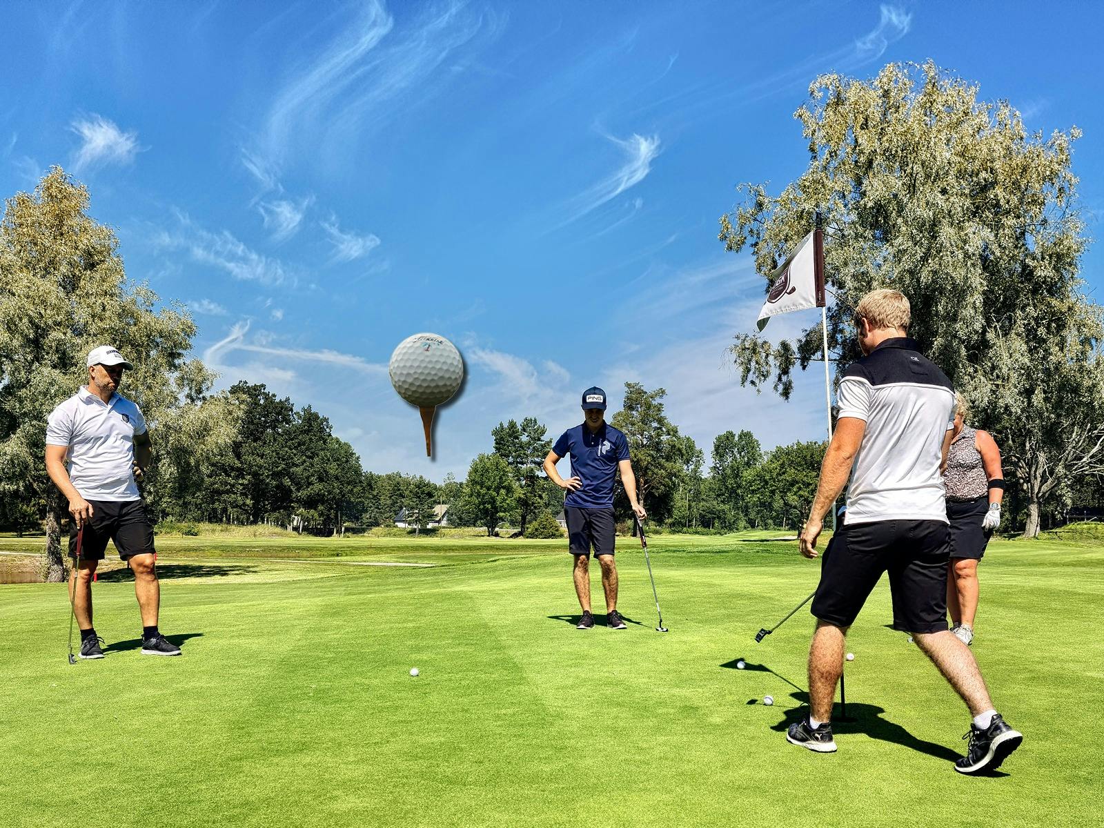 golf course with players on the green