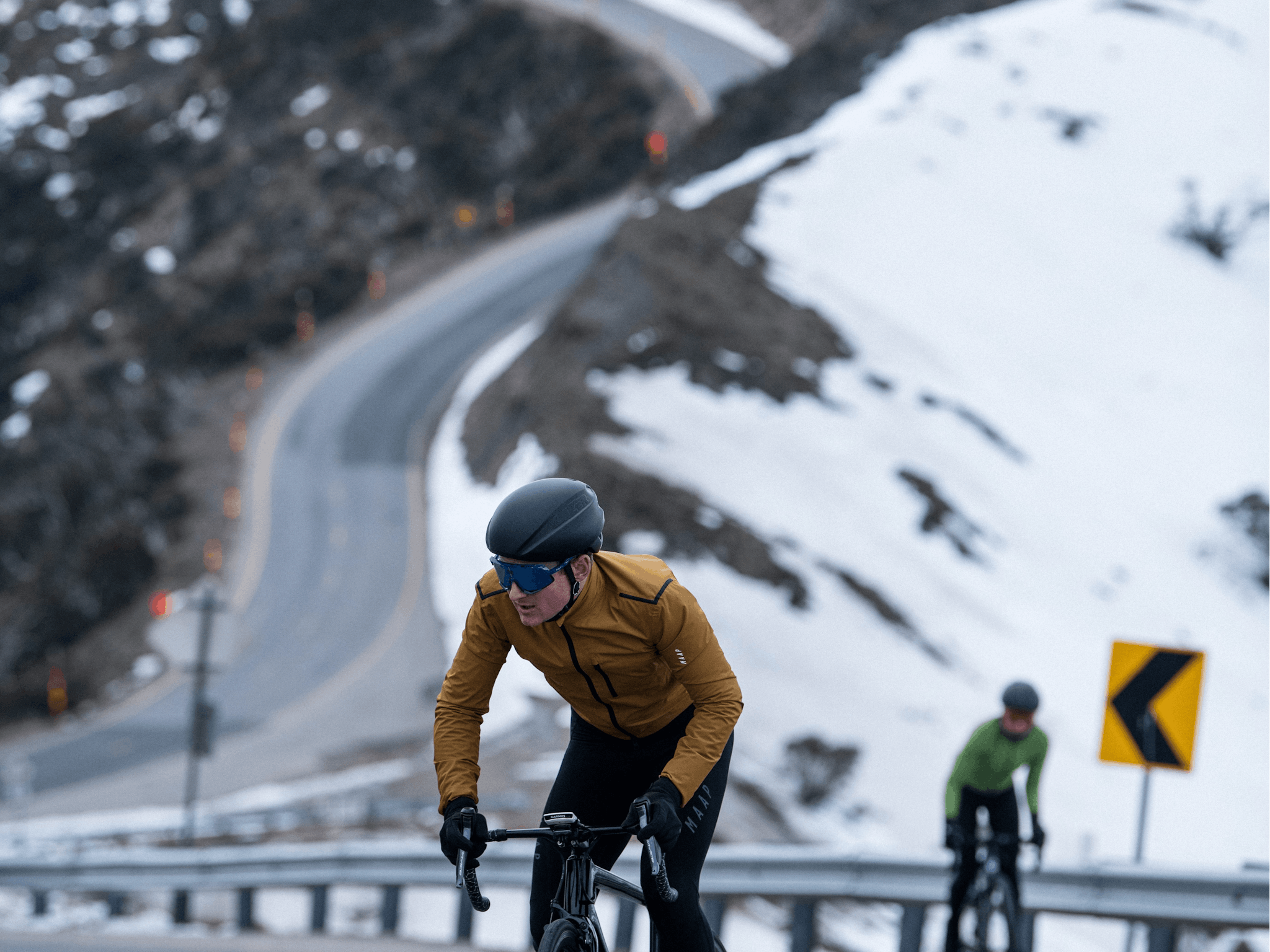 cyclist on road with snow