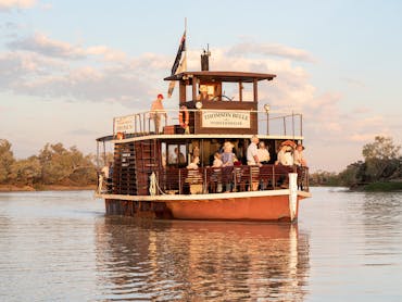 The Thomson Belle paddlewheeler cruising on the Thomson River, Longreach The Thomson Belle paddlewheeler cruising on the Thomson River, Longreach