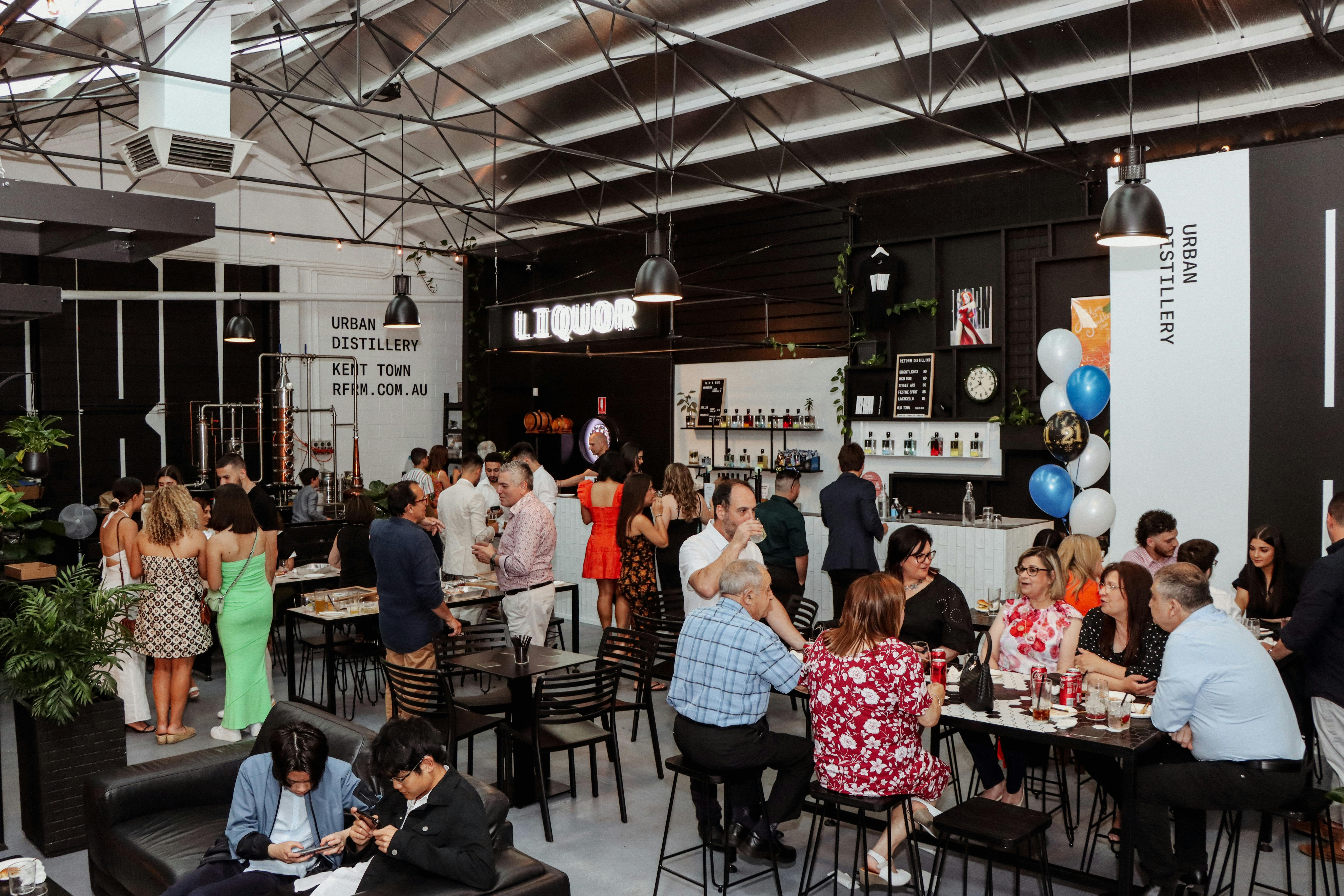 View of inside of reform during a busy event with approximately 40 people