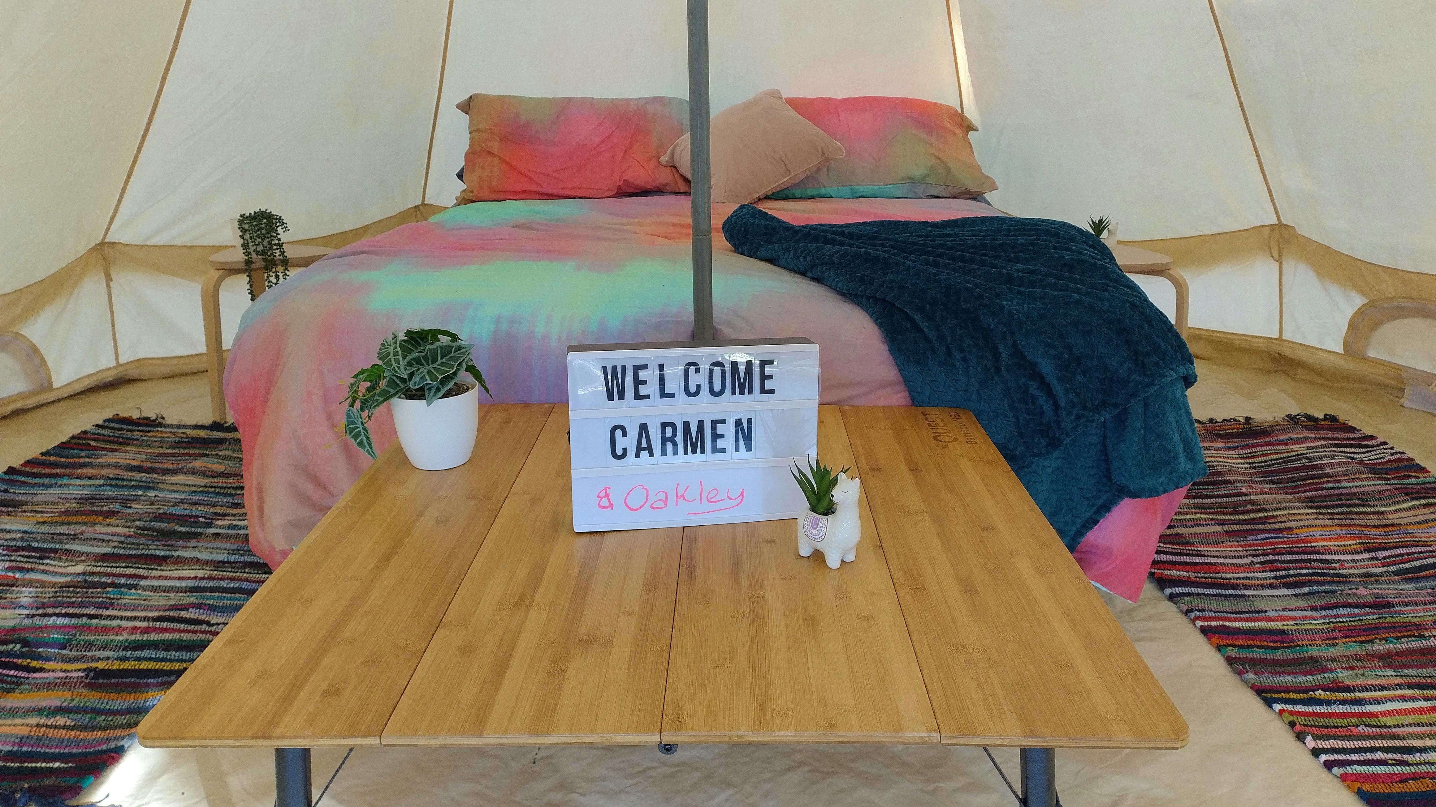 Welcoming sign on the inside of a bell tent