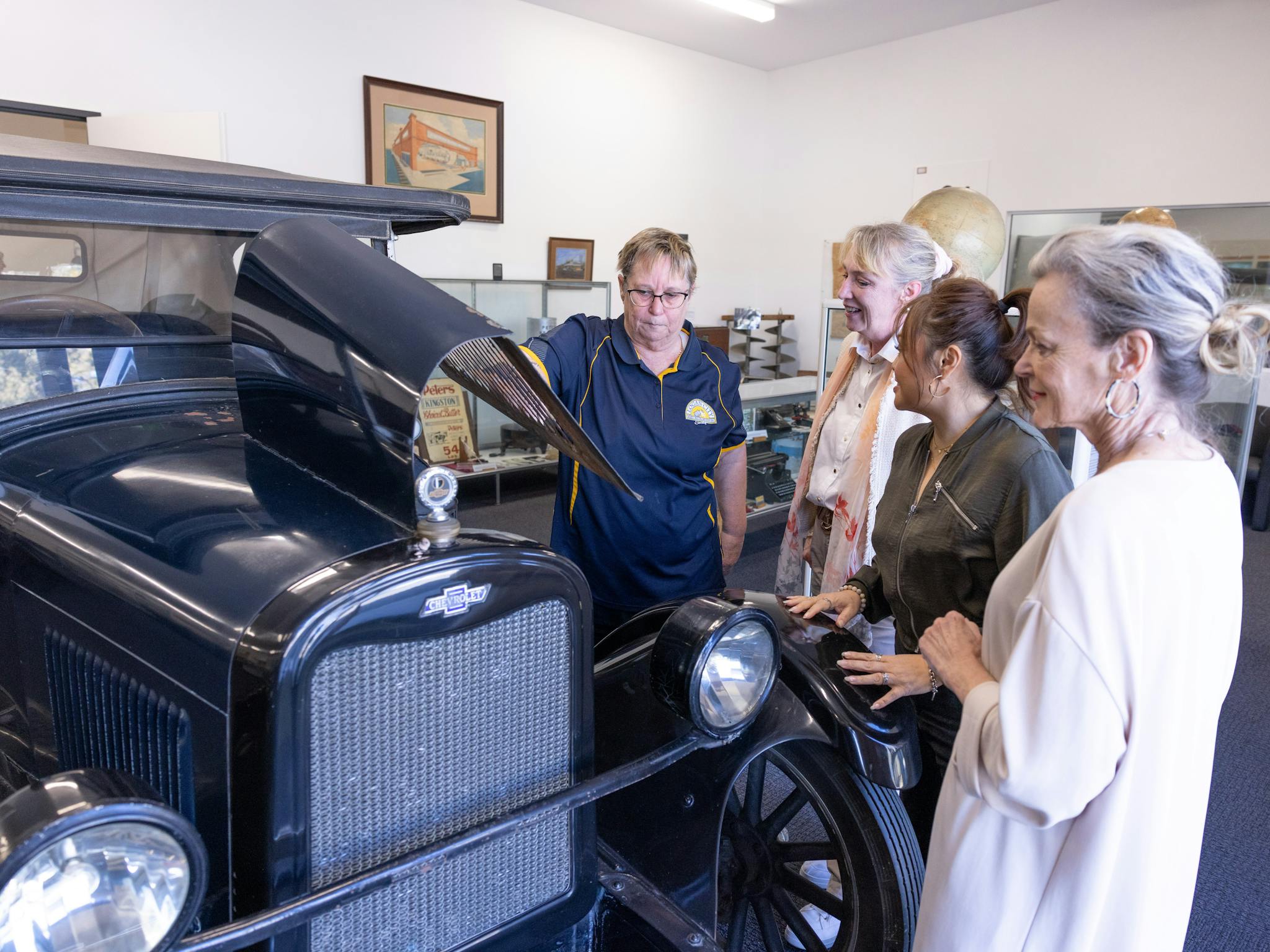 visitors admiring the 1926 chevrolet sedan donated by the Pettigrew family visitors admiring the 1926 chevrolet sedan donated by the Pettigrew family