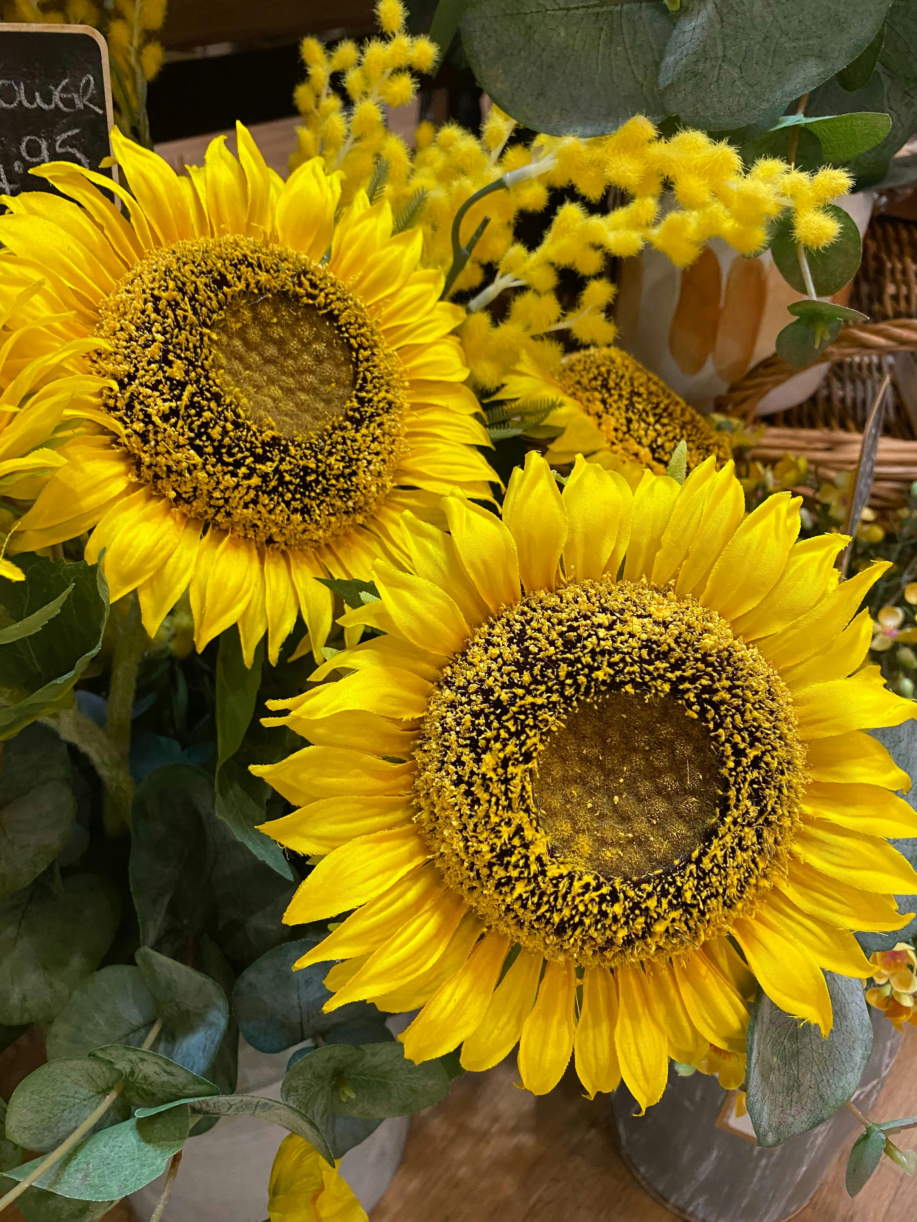 Floral displays of bright yellow sunflowers