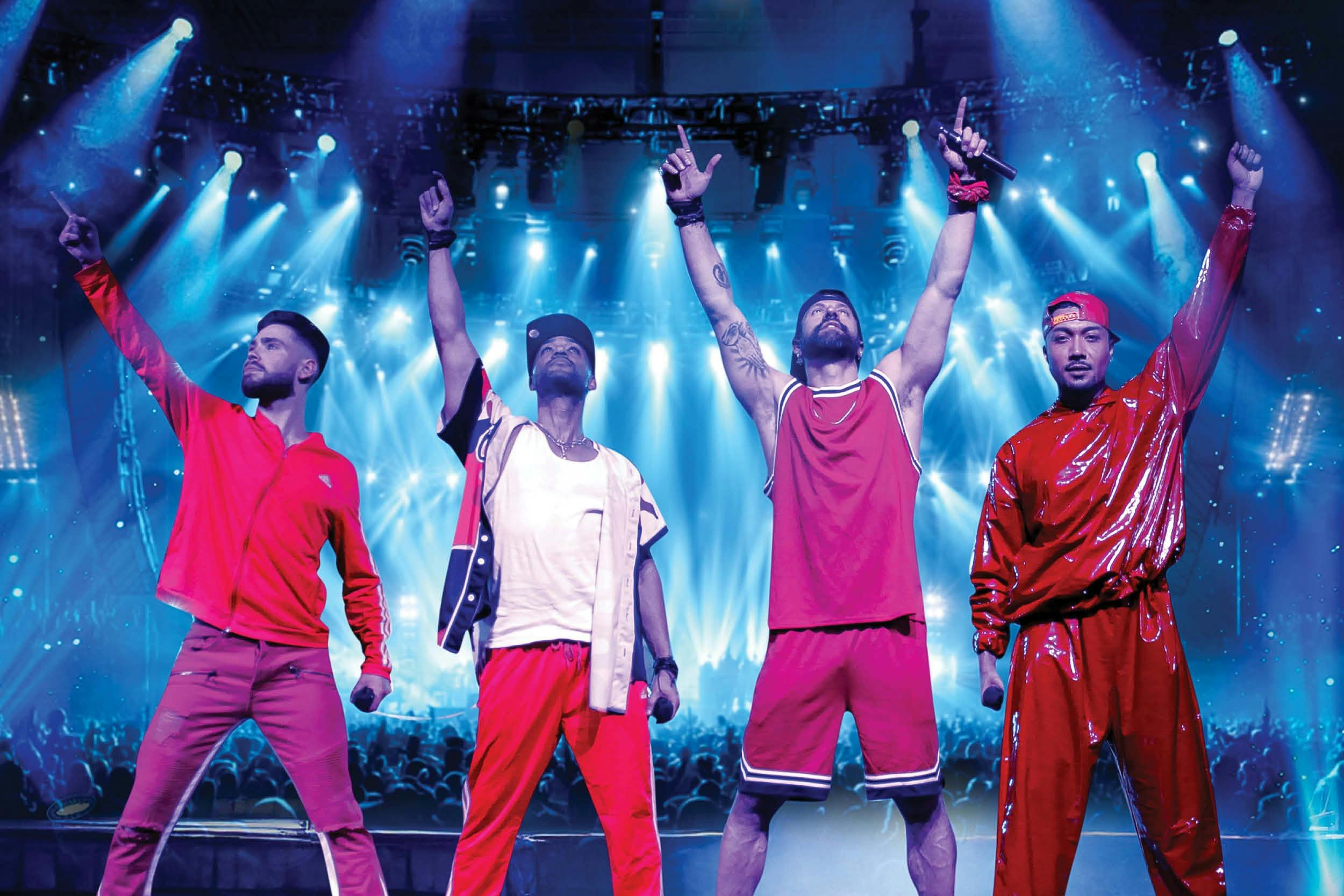 Image of 4 men on stage