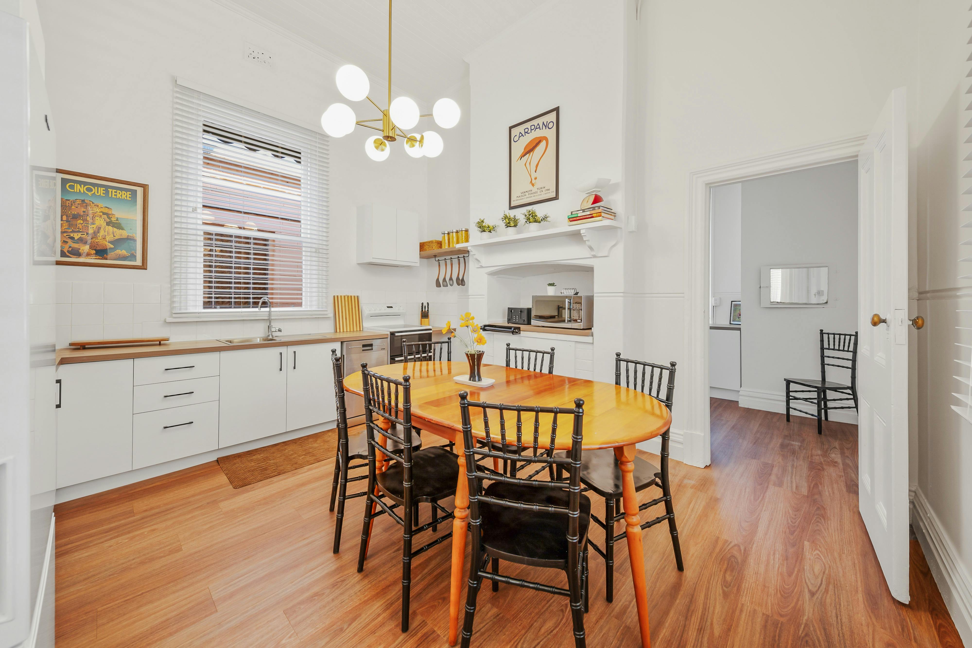 Six seater dining table, dishwasher, microwave, electric oven and stove top, toaster, kettle, fridg