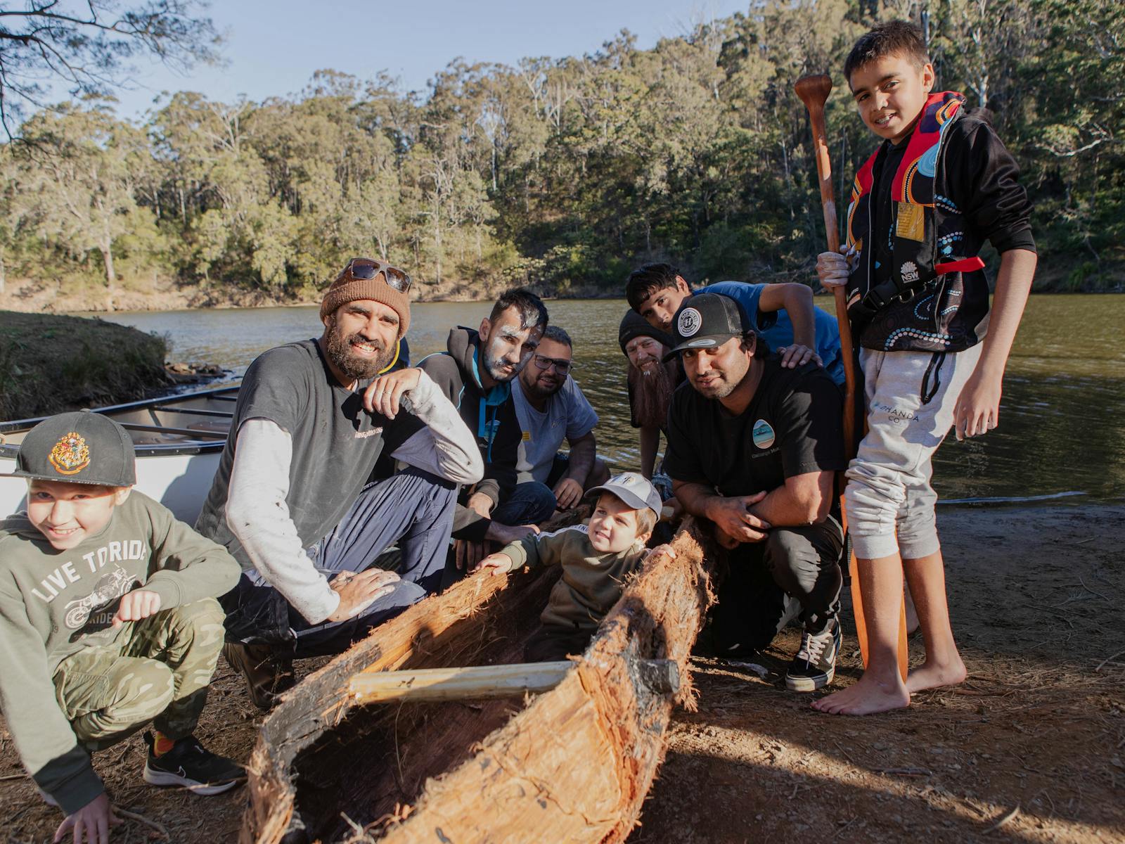 Aboriginal Youth with a Bark Canoe by the water