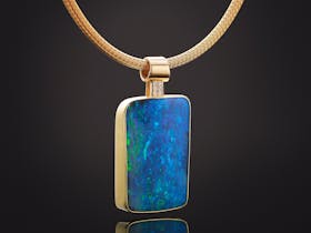 Queensland solid boulder opal pendant sent in 18ct yellow gold.