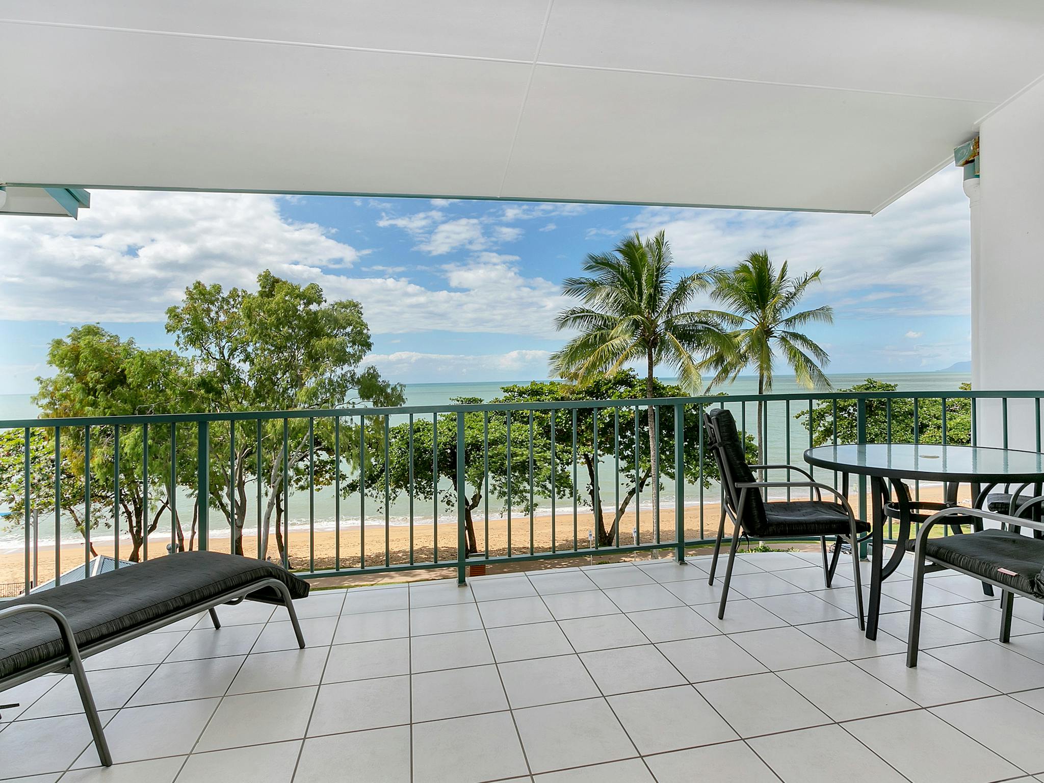 Large private balcony with seating to enjoy the beachfront breezes. Large private balcony with seating to enjoy the beachfront breezes.