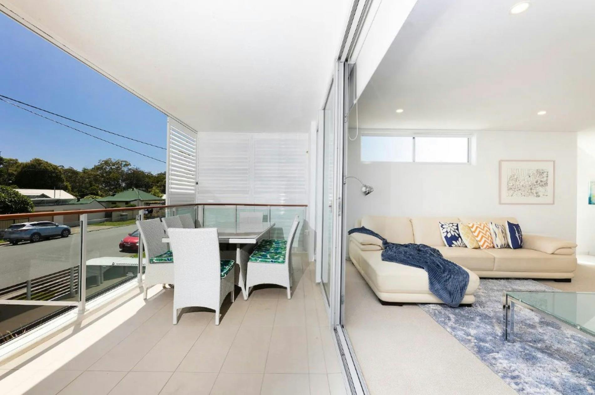 Lounge out to balcony, with 6 seater setting