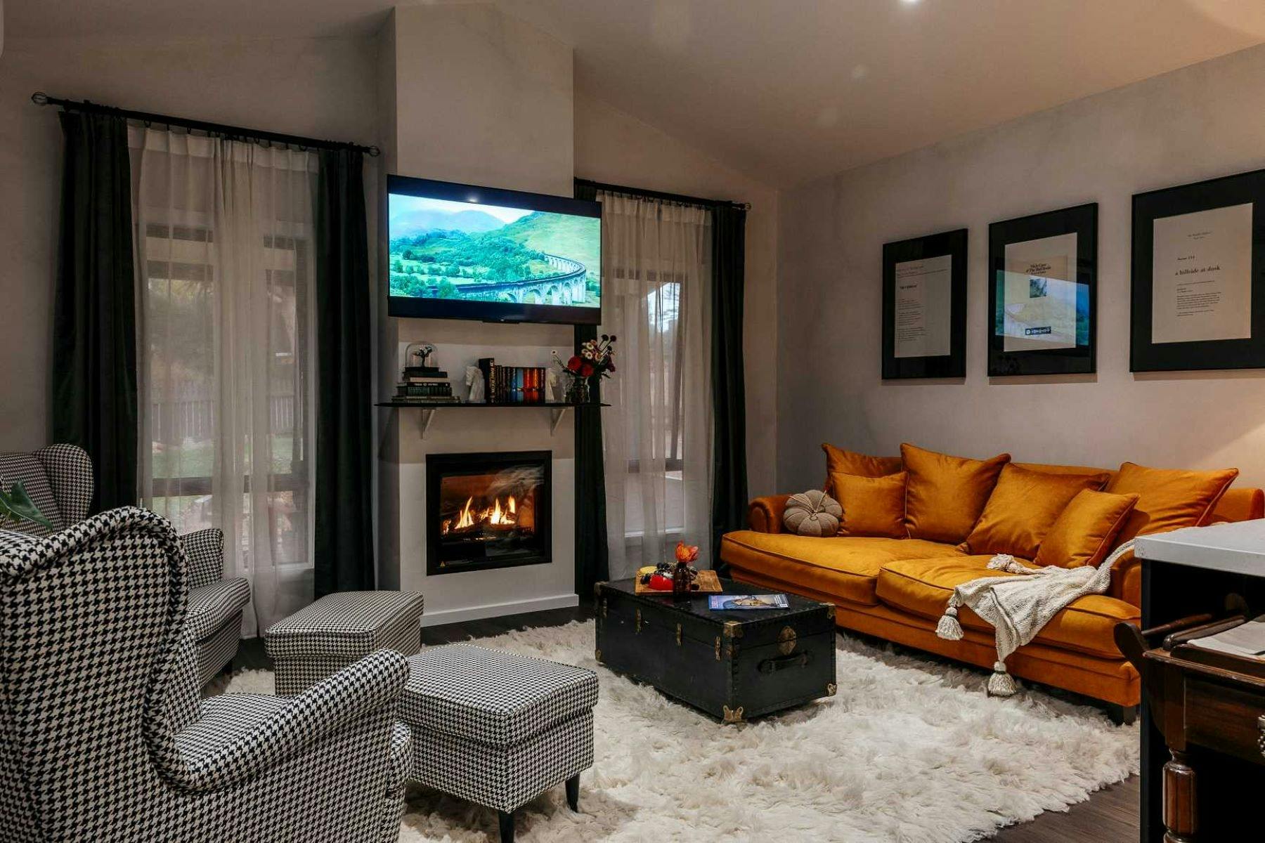 Gas log Fireplace, Giant couch and comfy arm chairs for curling up with a book or a movie marathon