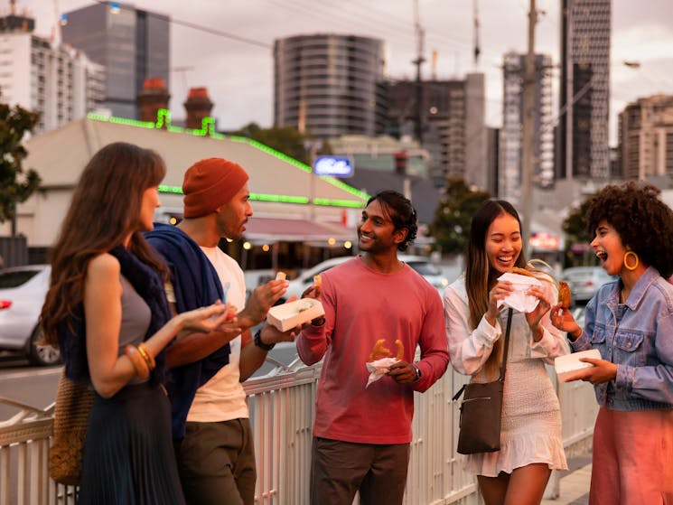 Friends walking through Little India in Harris Park