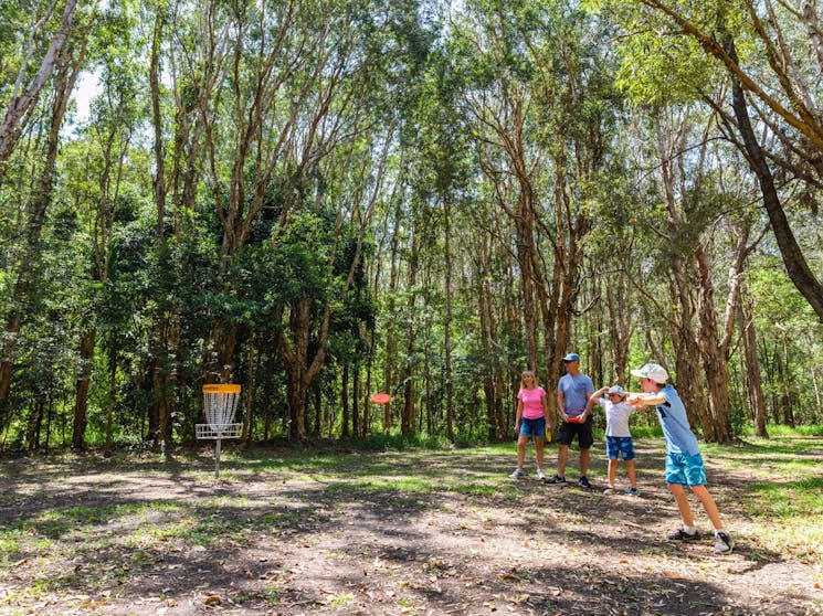 Family playing Disc Golf