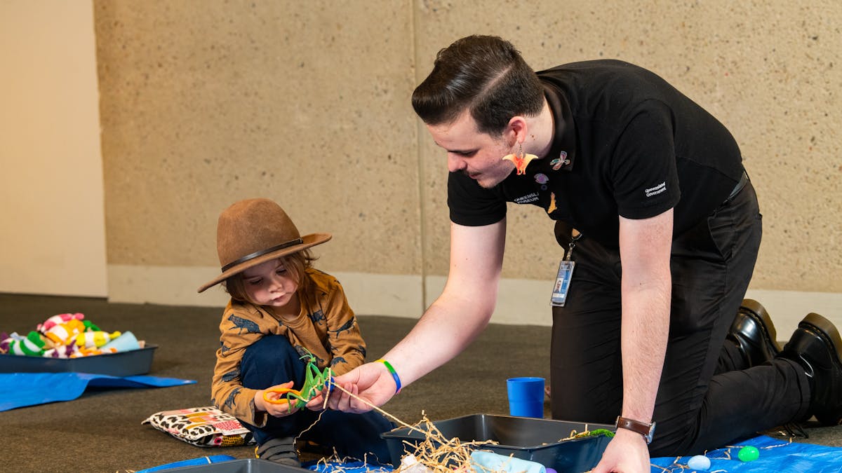 Queensland Museum Kurilpa staff and a child