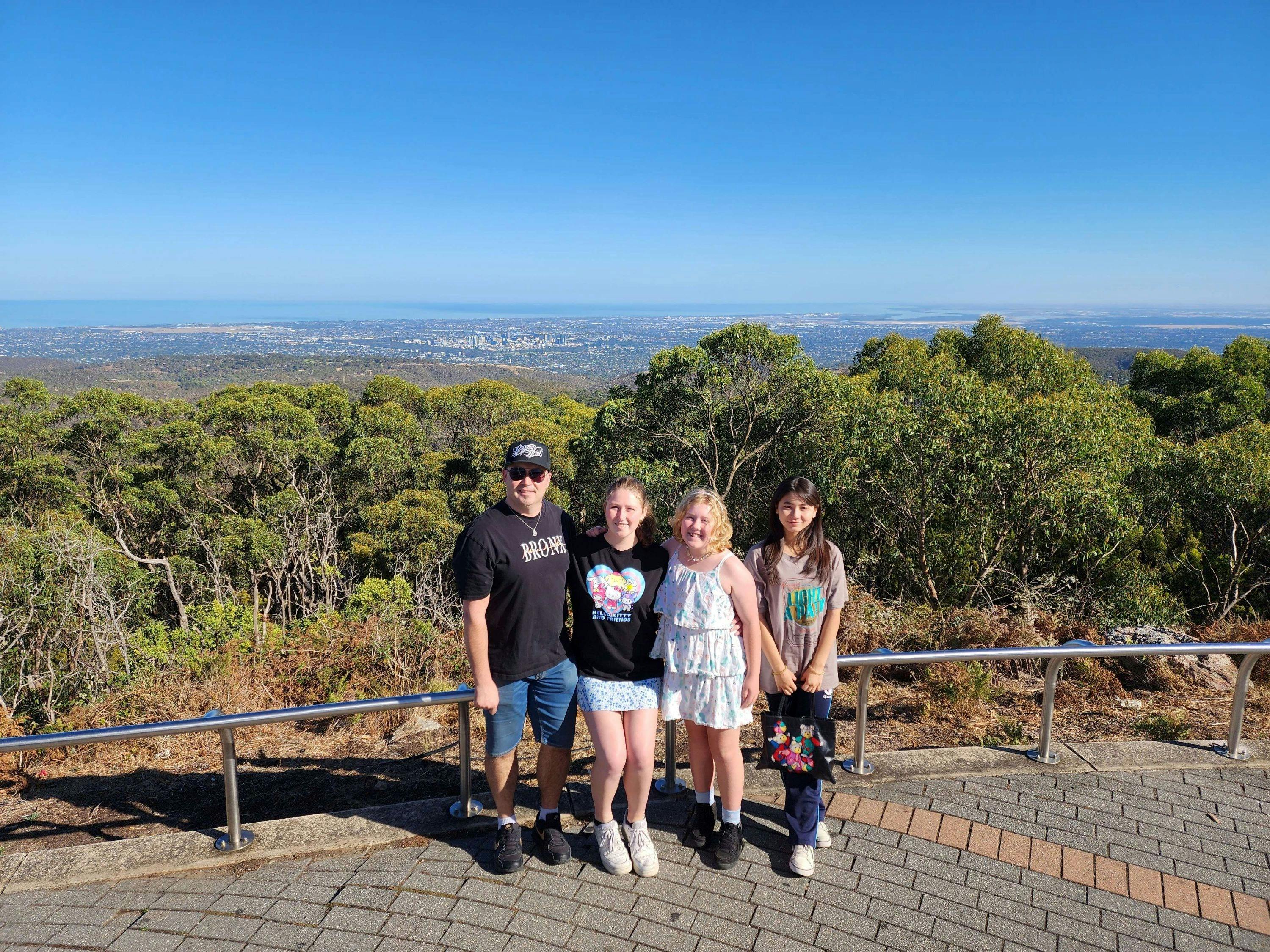 Family of 4 posing at Mount Lofty Summit Lookout