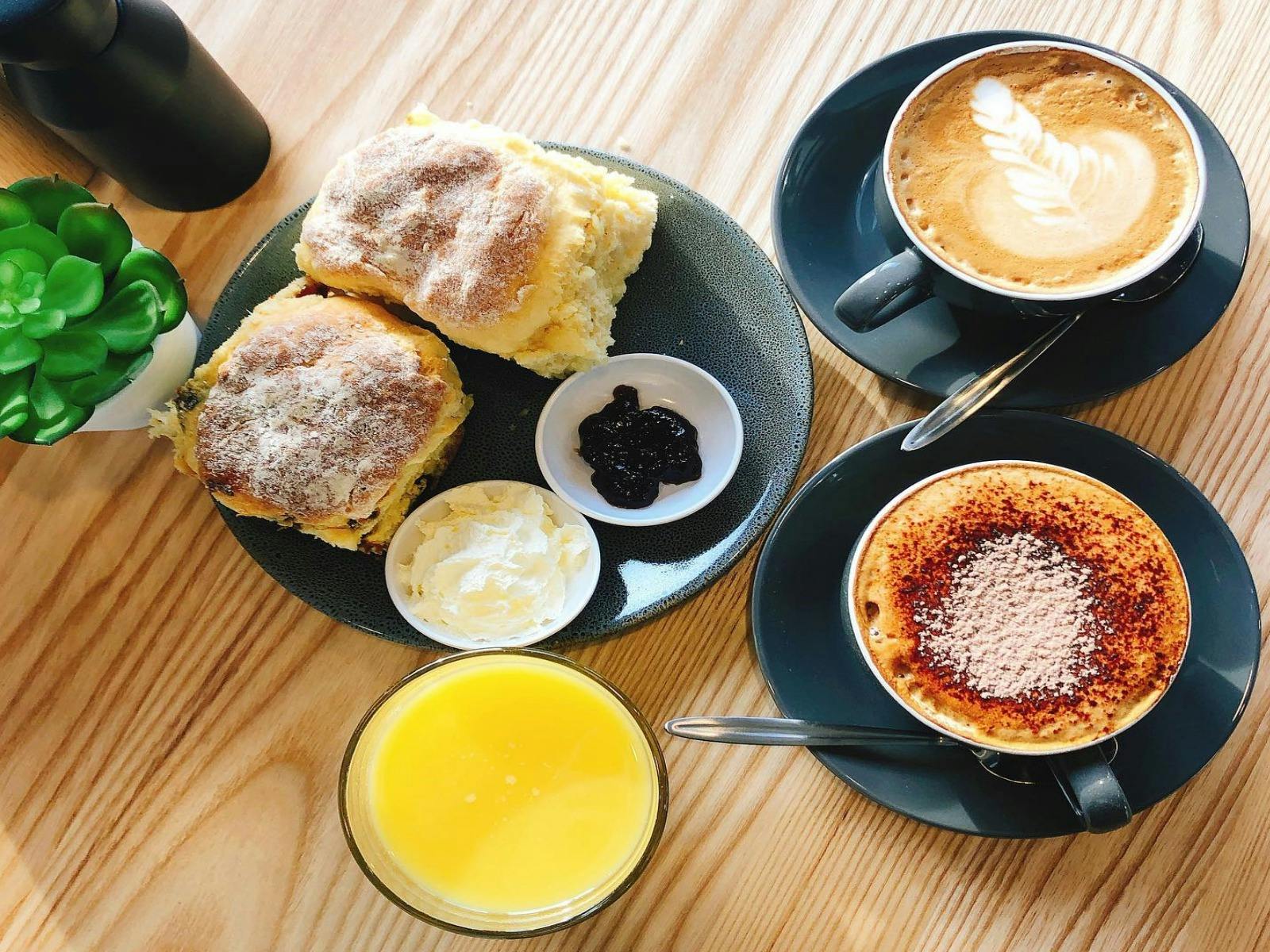 lovely fresh baked scones with jam and cream