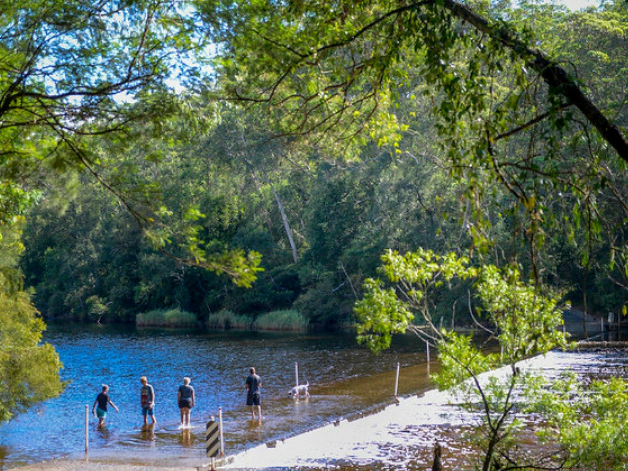 Children play in the river at Shallow Crossing.