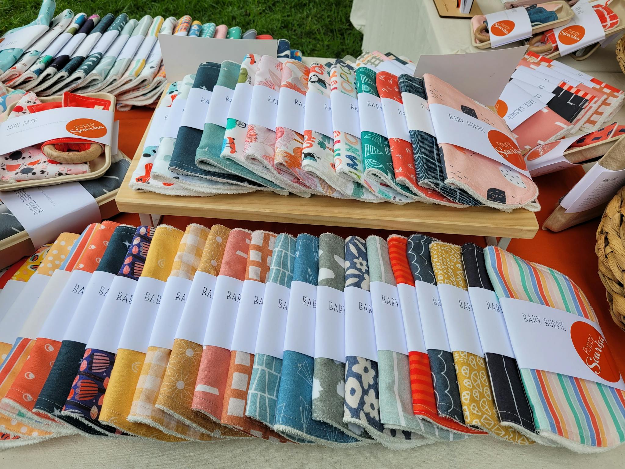 Coloured baby bibs on display
