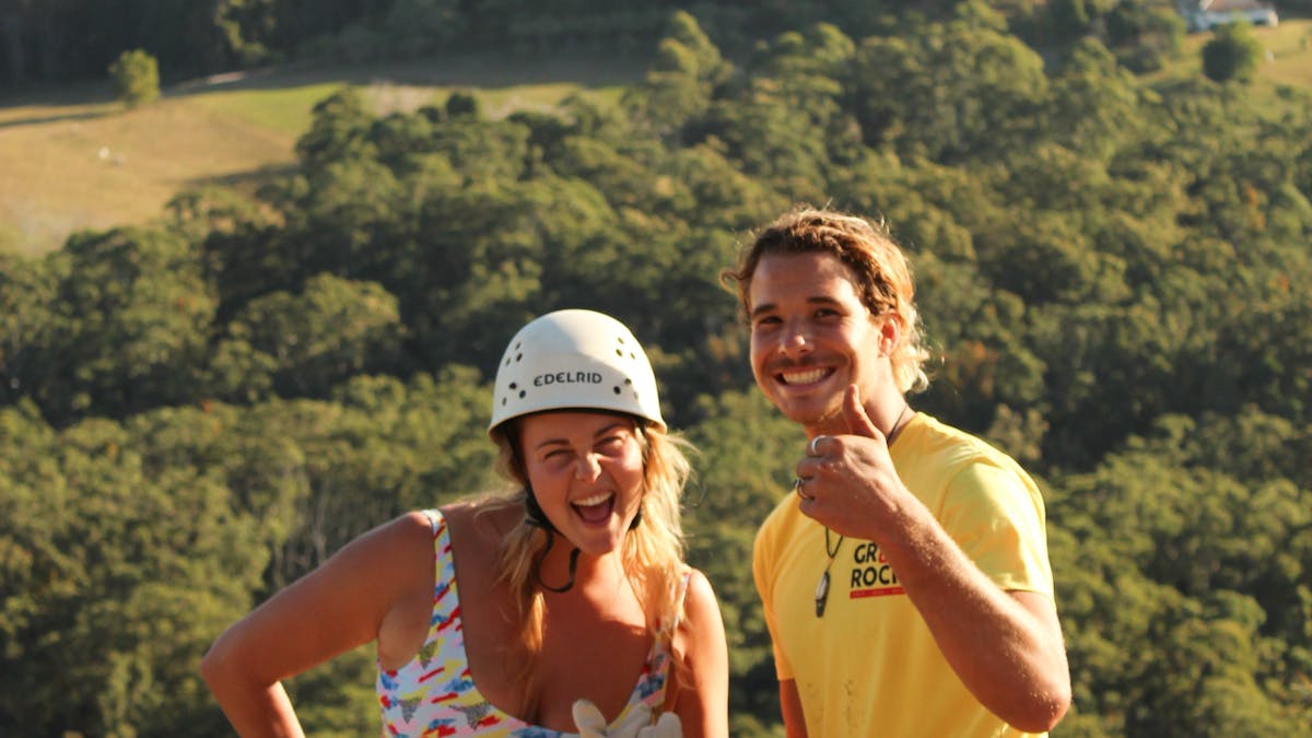 Having an awesome time with their instructor Orion abseiling down Mt Tinbeerwah