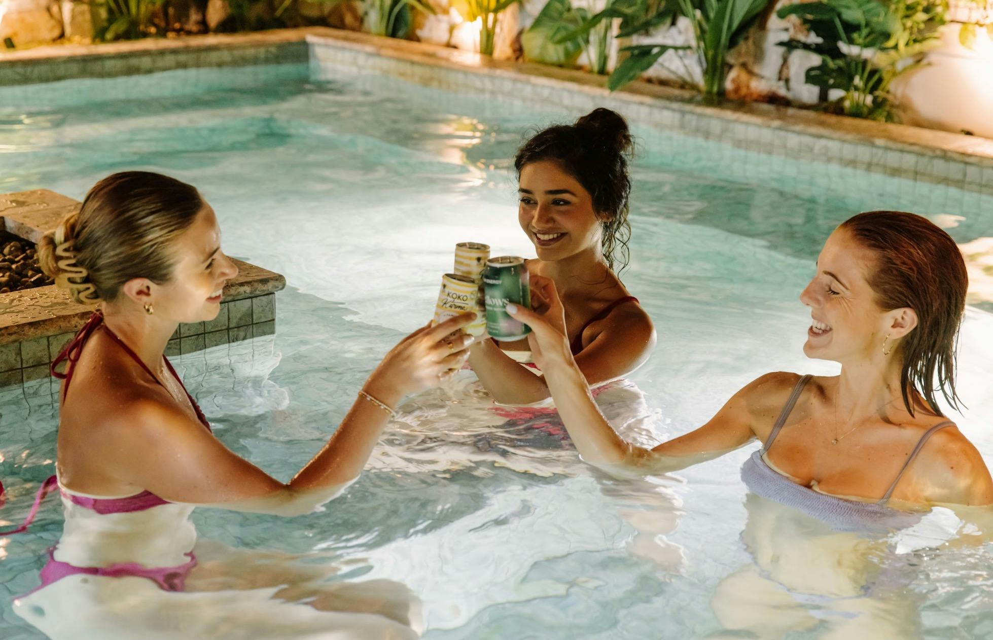 friends cheersing at soak