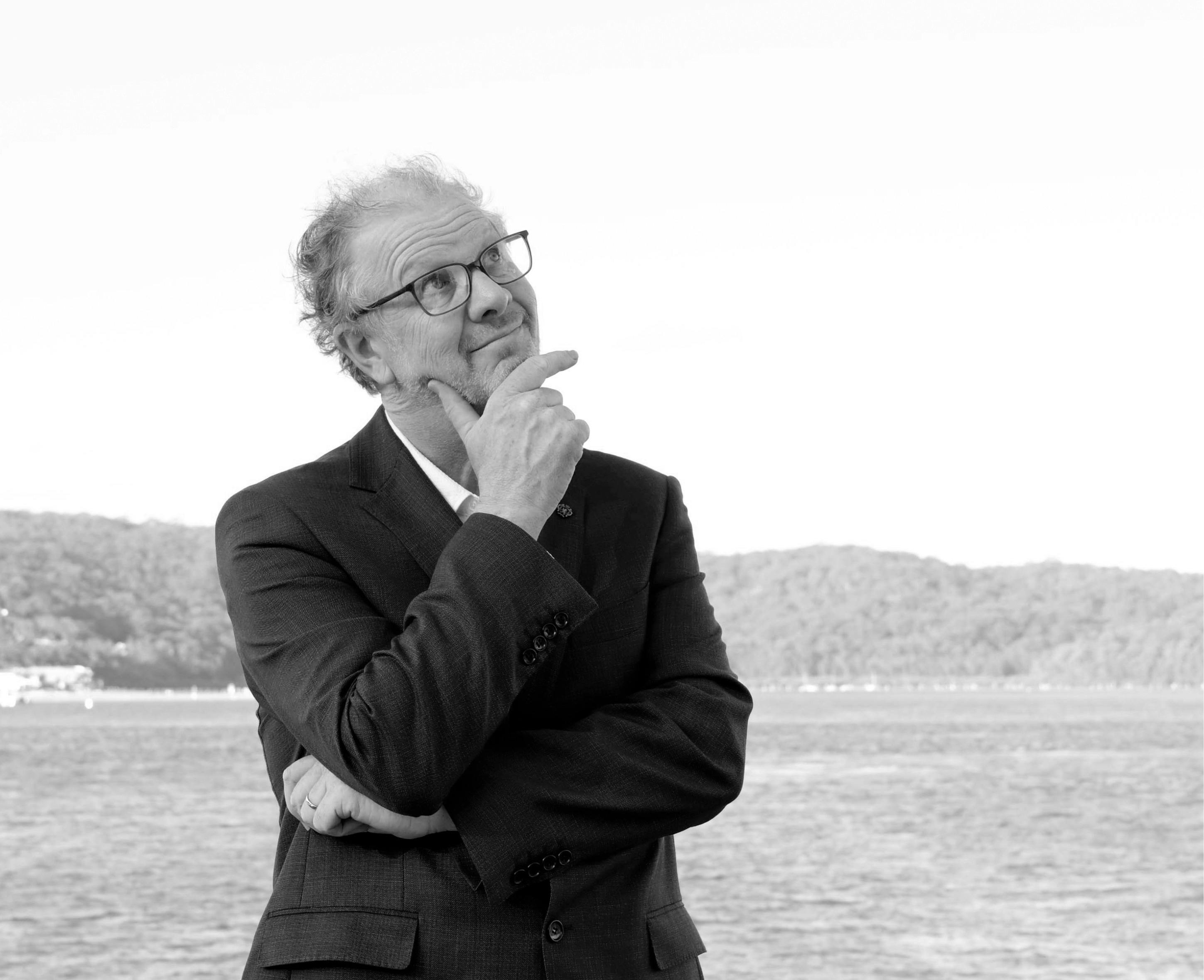 Guy Noble looking comedically thoughtful in black and white.