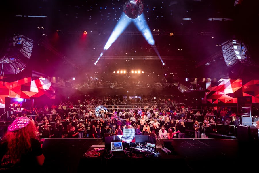 From the stage, a perspective photo of a huge crowd with stage lighting all around