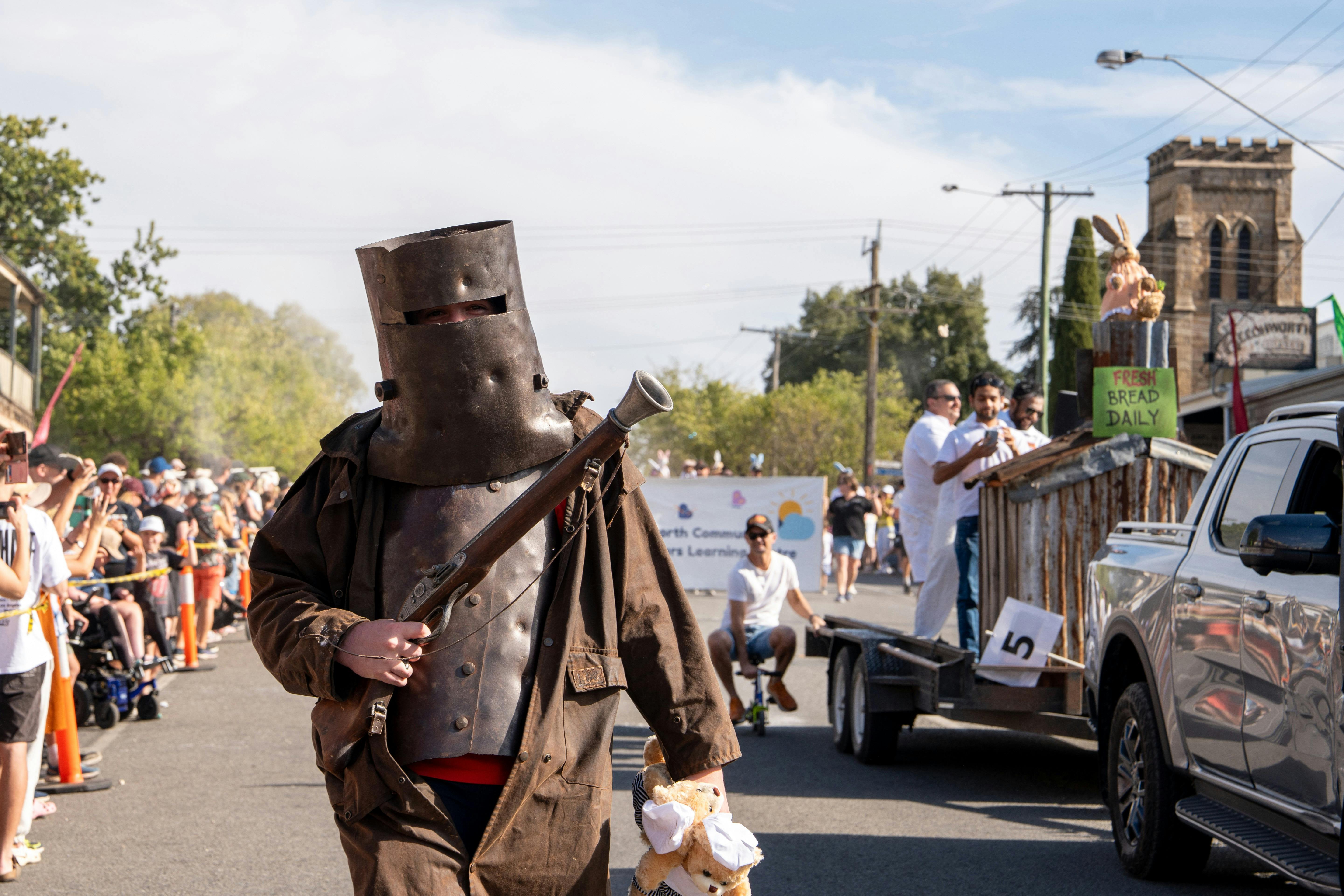 Ned Kelly walking with Beechworth Bakery float