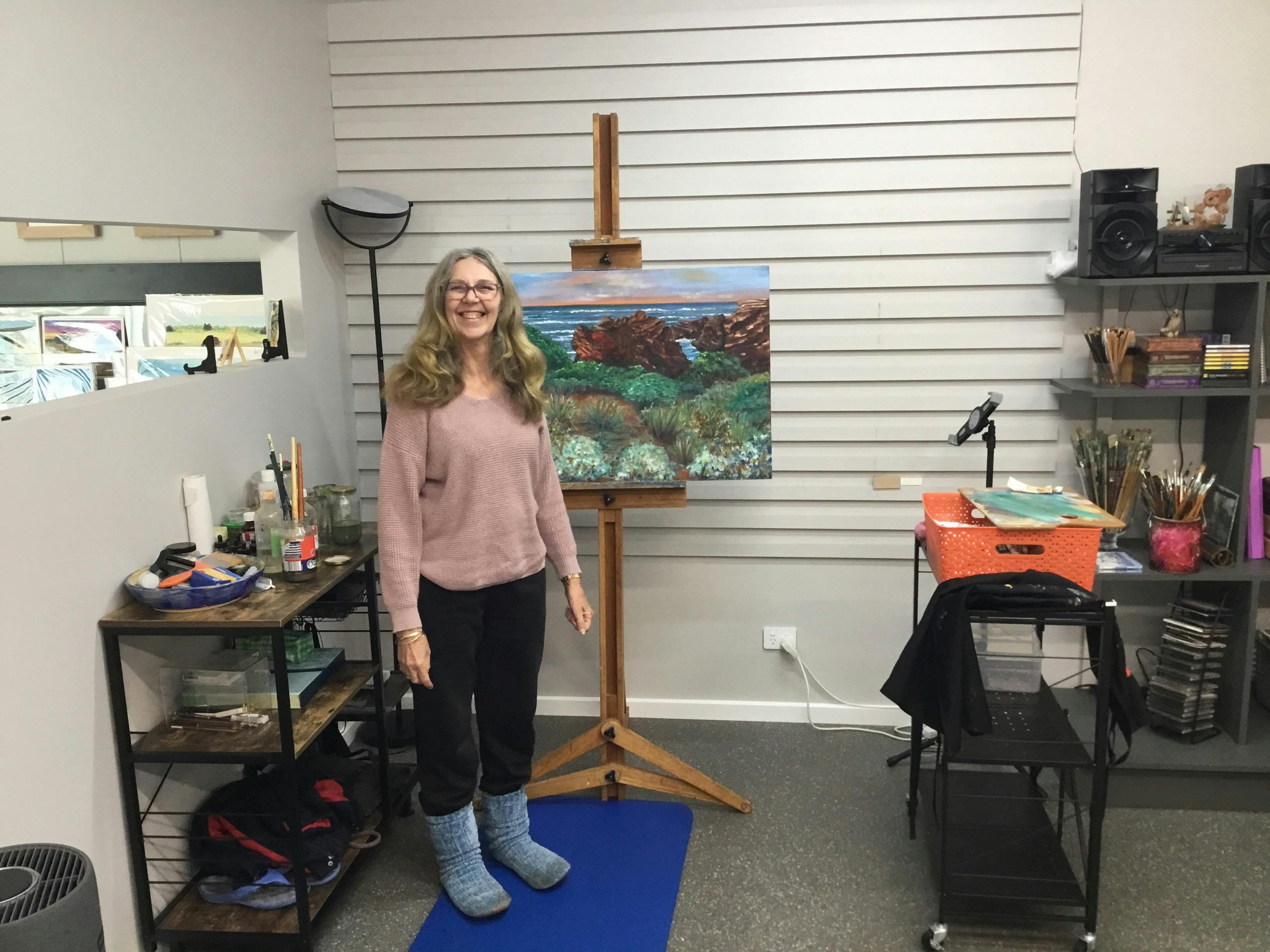 Alexandra in front of her new workspace.