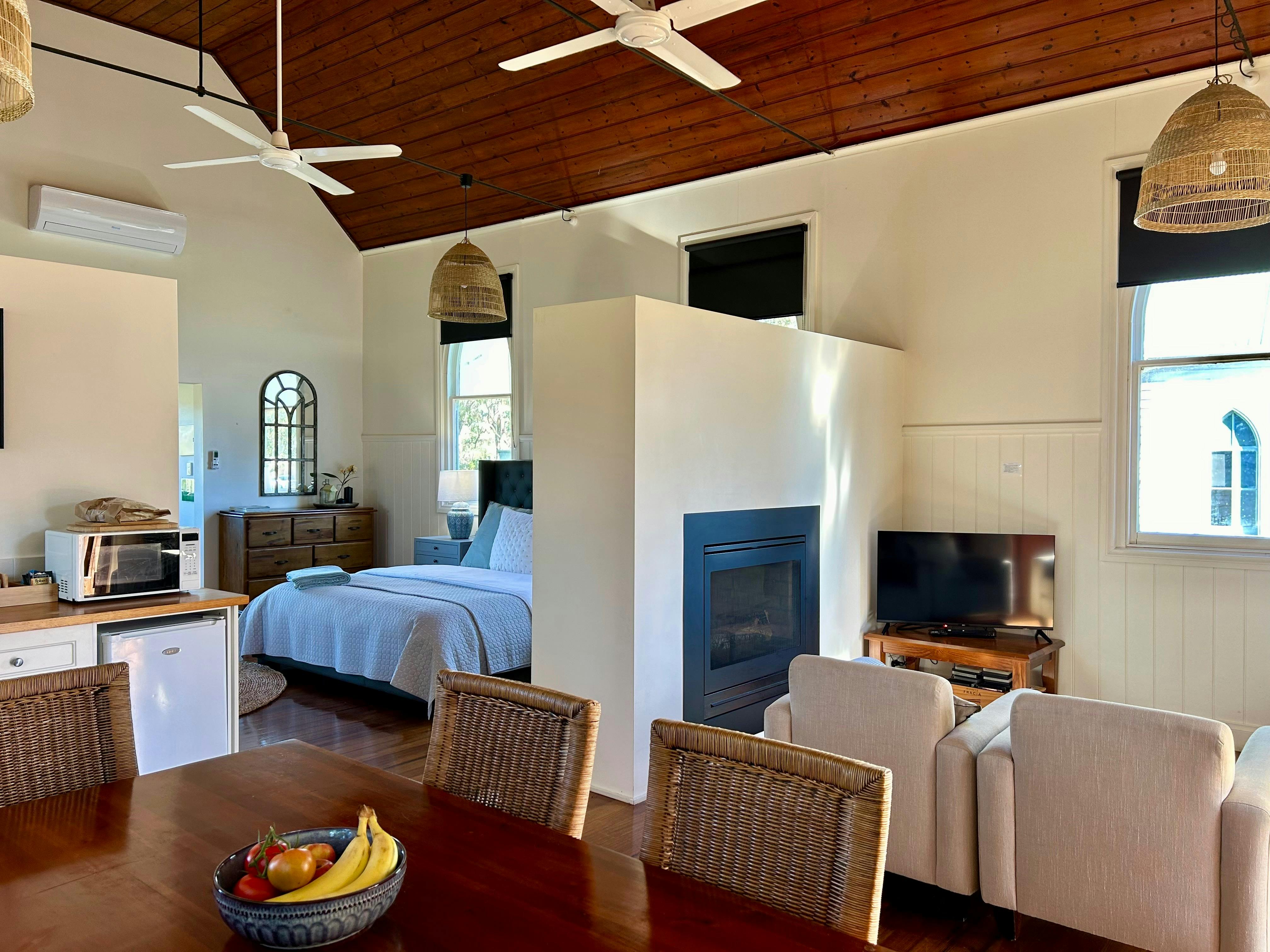 View across dining table to bedroom area & sitting room