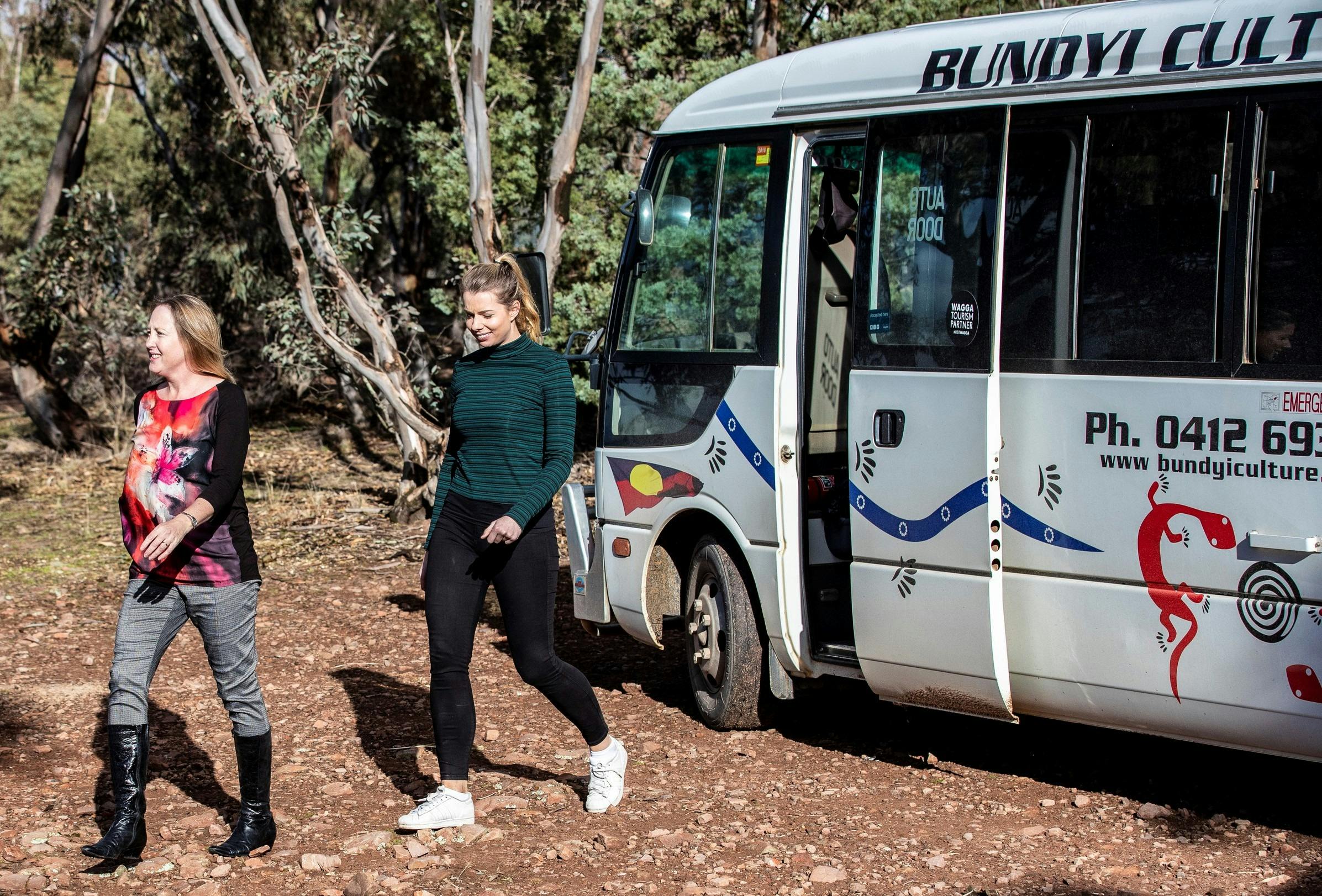 Women disembarking the Bundyi Aboriginal Cultural Tours bus in Wagga Wagga