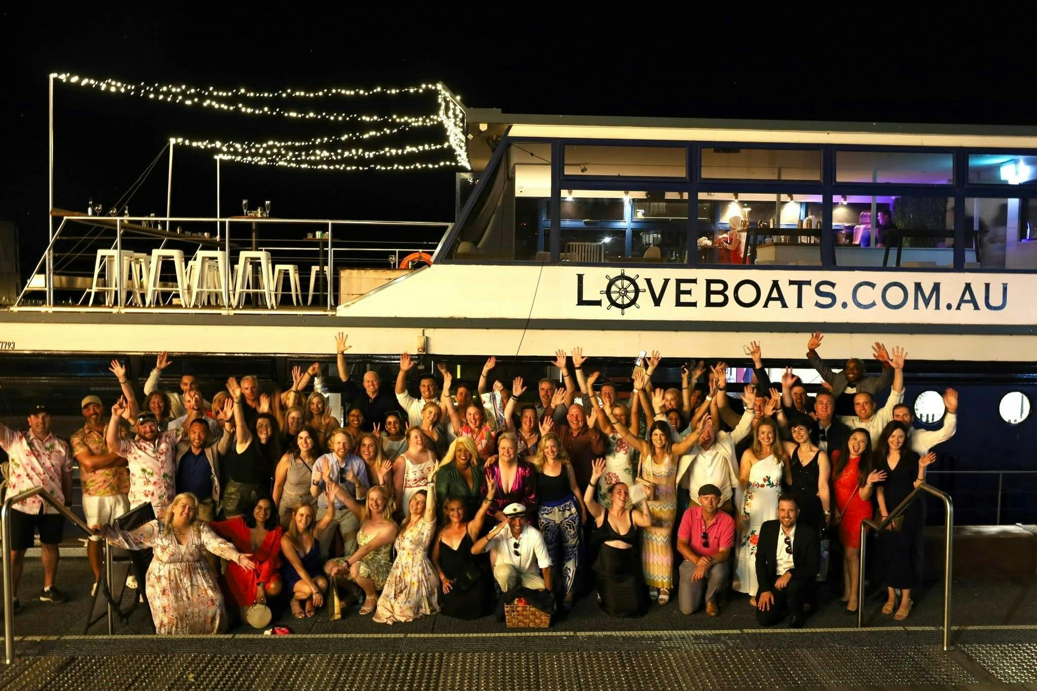 Large boat with lots of people on it celebrating and having fun
