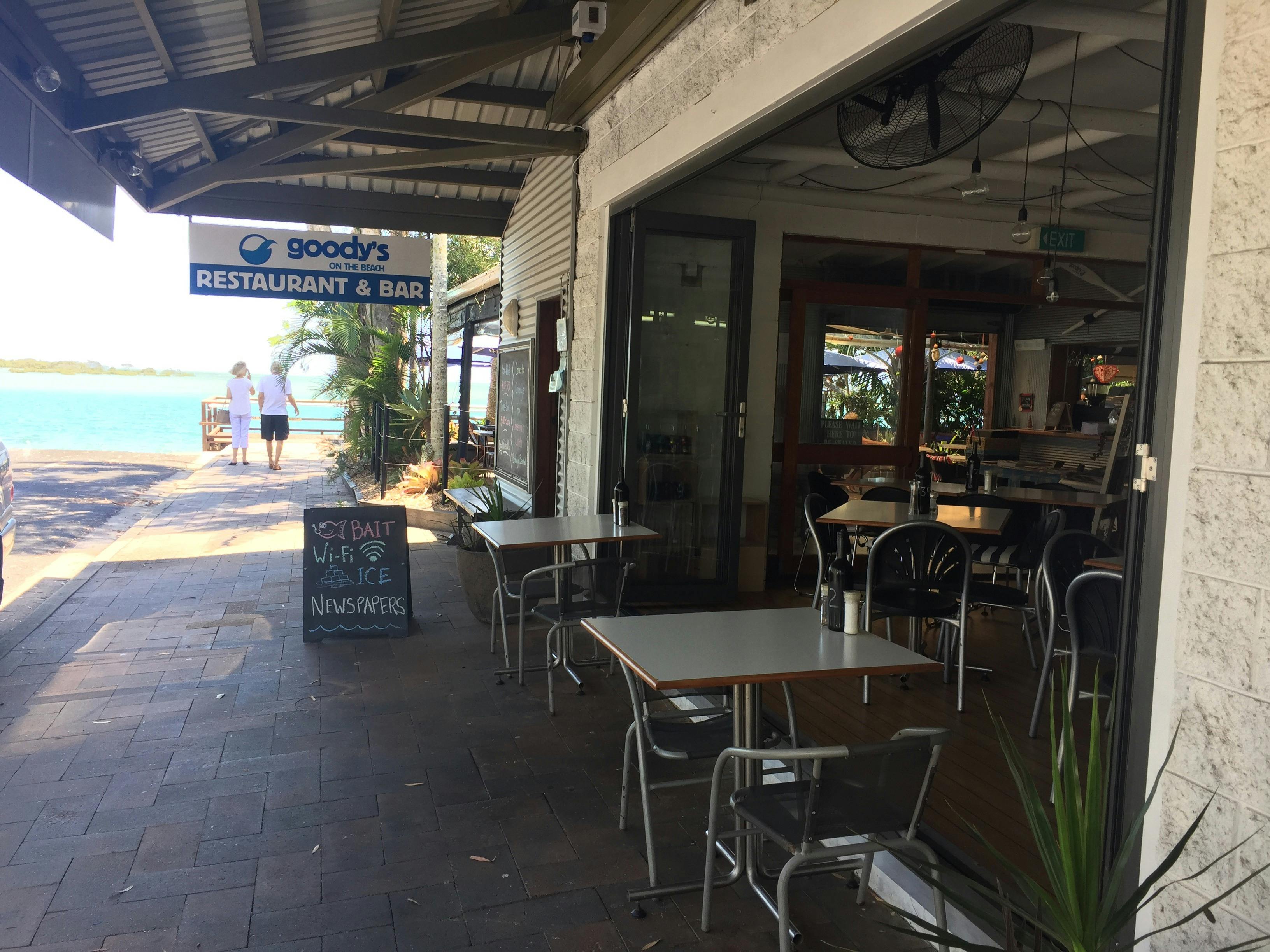 photo showing the side of Goody's on the Beach with open french doors leading to the footpath