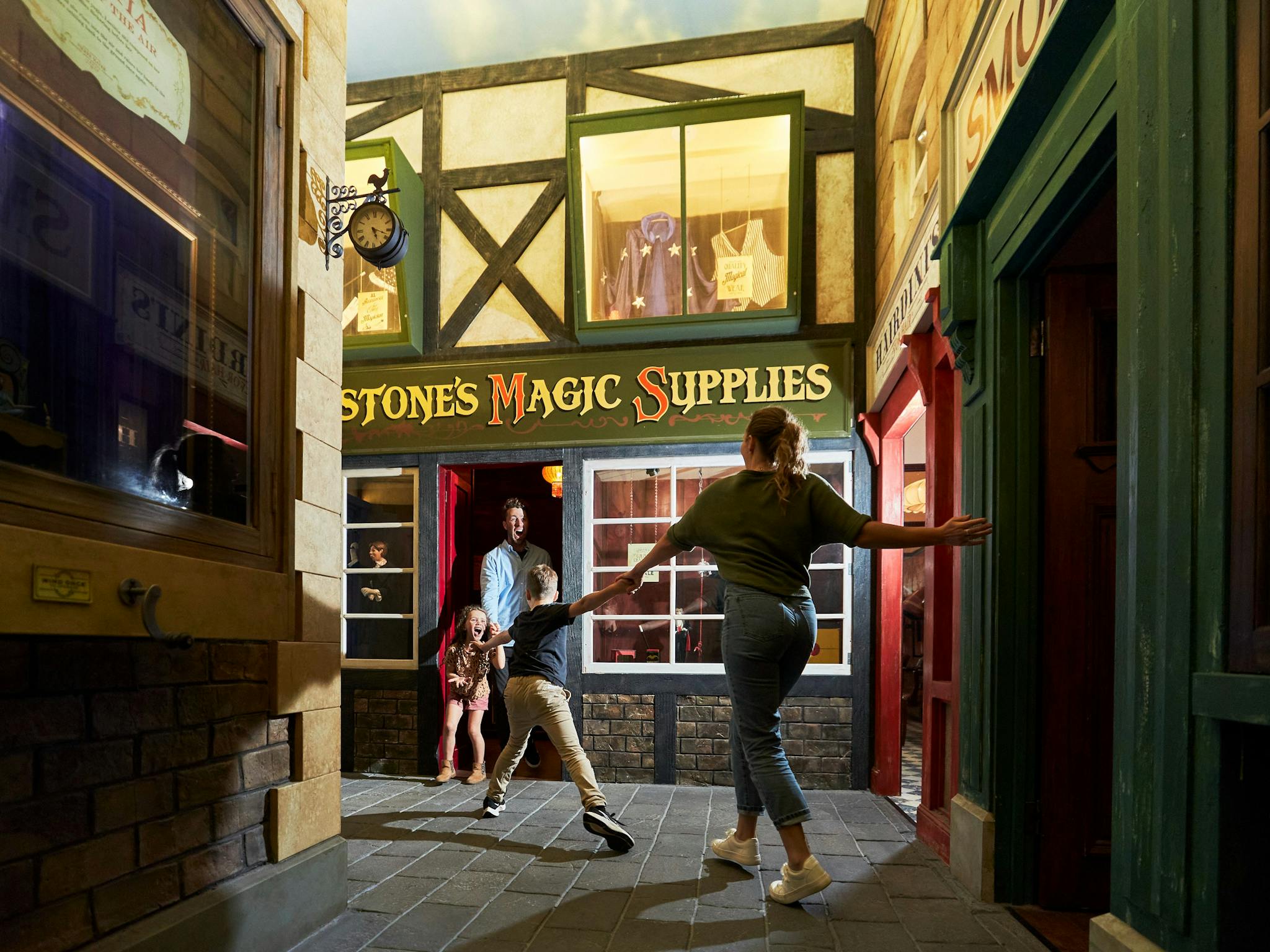 Family exploring Magic Manor at A Maze'N Things