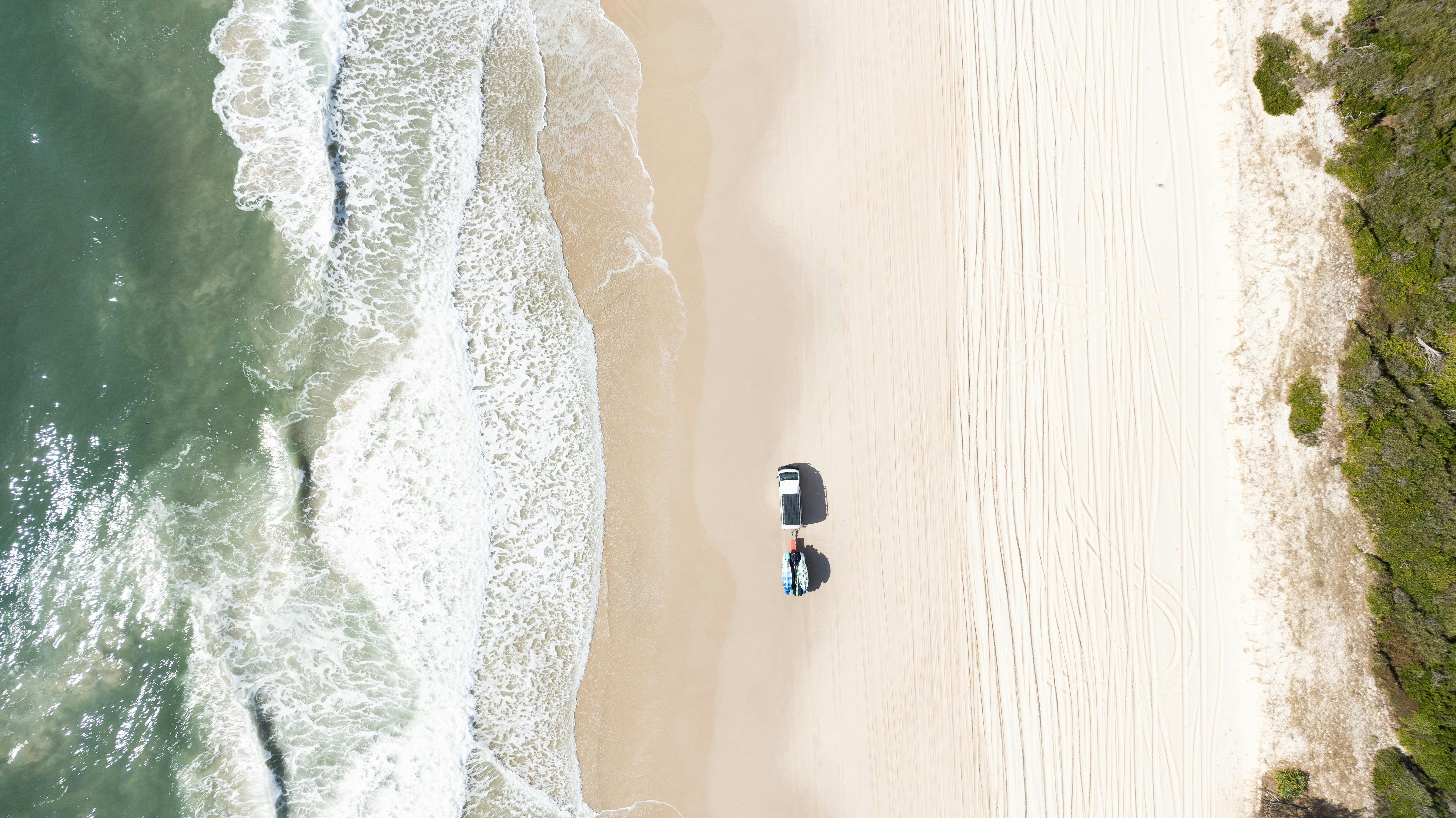 Aerial of 4WD on Woorim Beach, Bribie Island