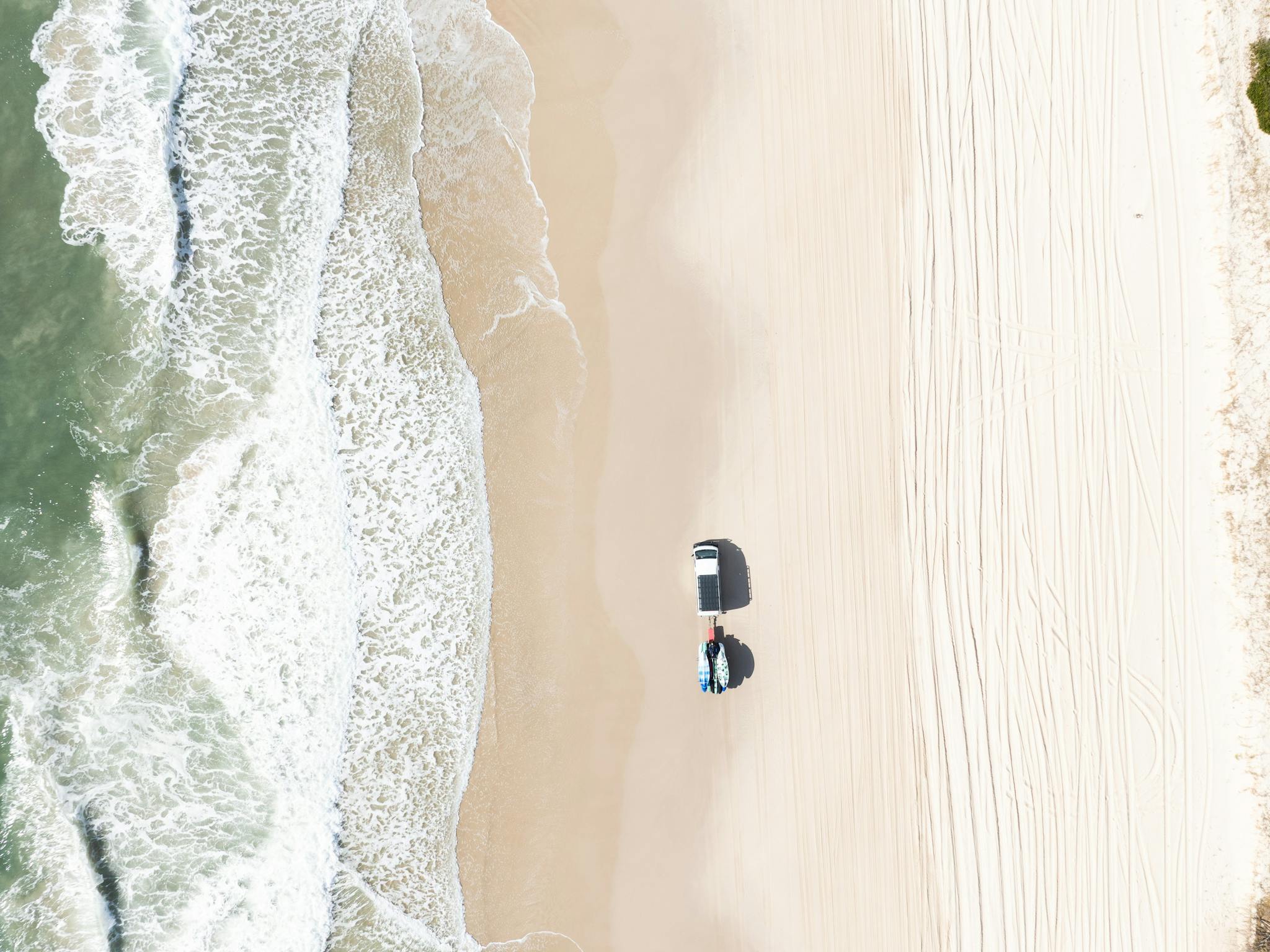 Aerial of 4WD on Woorim Beach, Bribie Island