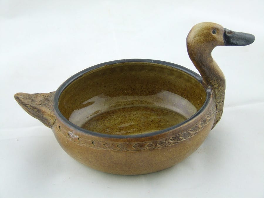 Pot altered to resemble a duck with head and tail