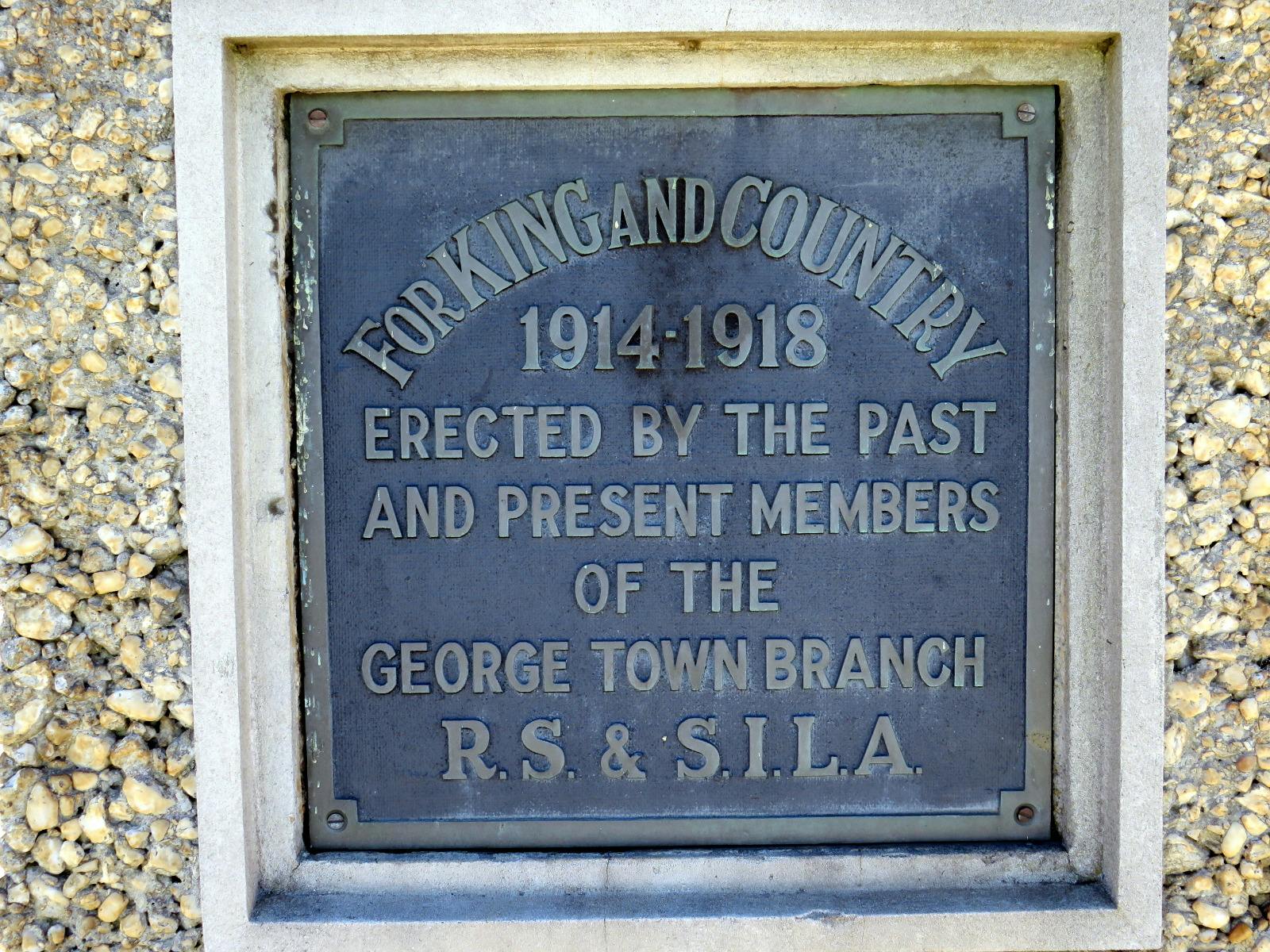 A close up of the WW1 brass plaque
