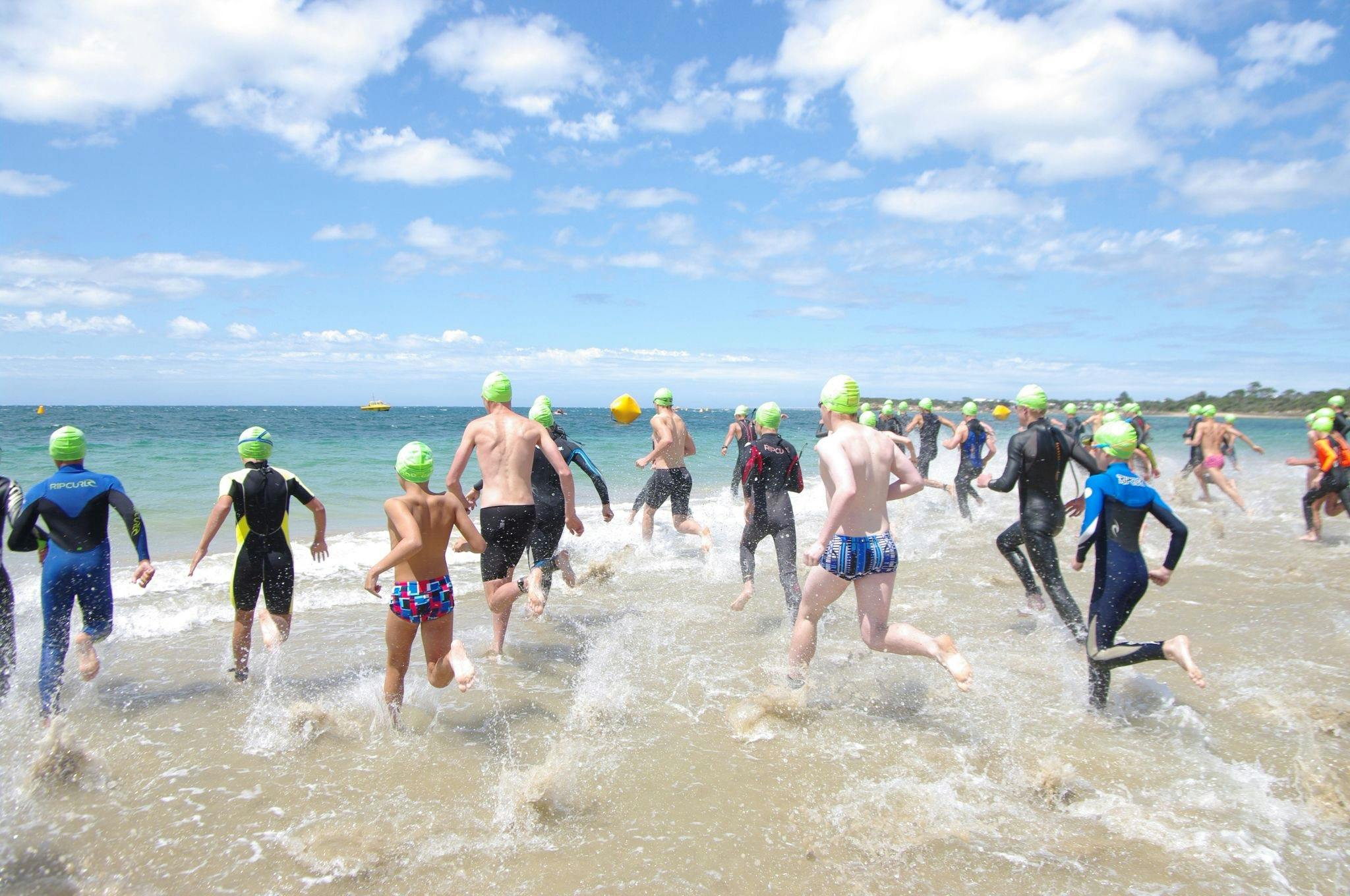 Swimmers entering the water