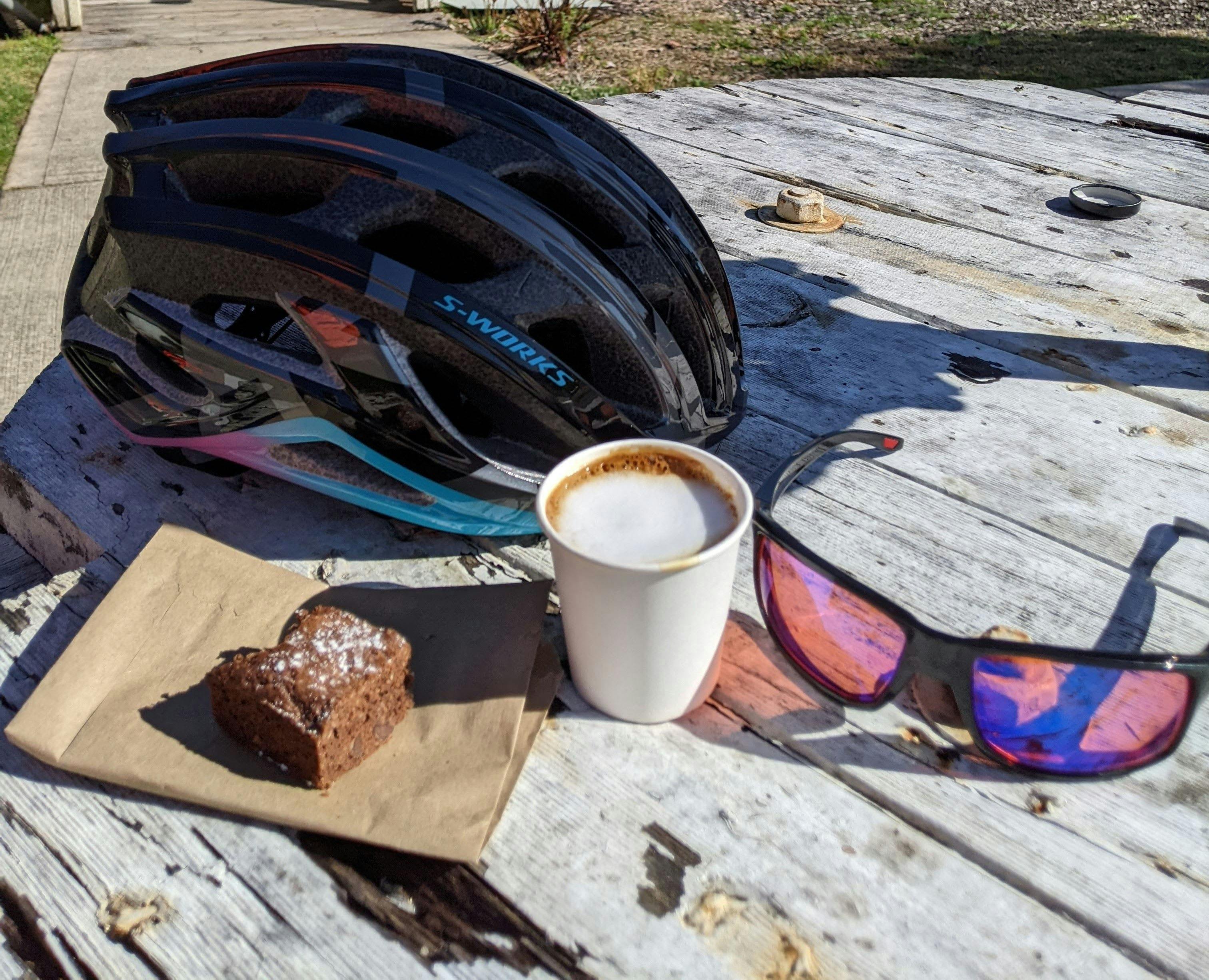 cycling helmet, sunglasses  coffee and cake