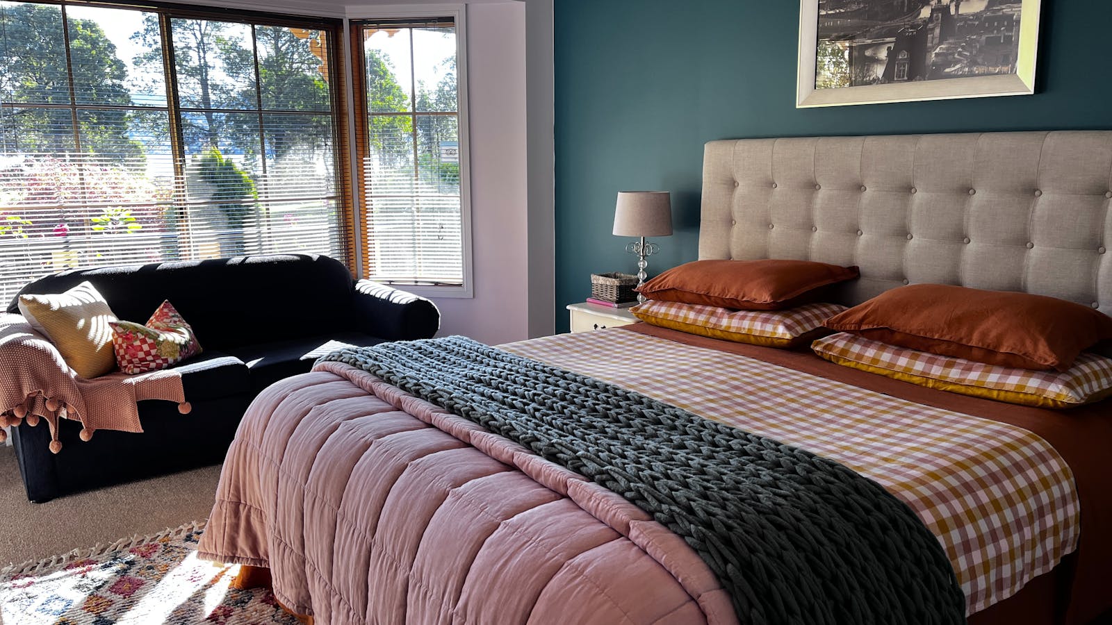 Dreamy bedroom of The Waterview apartment with KS bed and views over the garden to Cygnet Bay