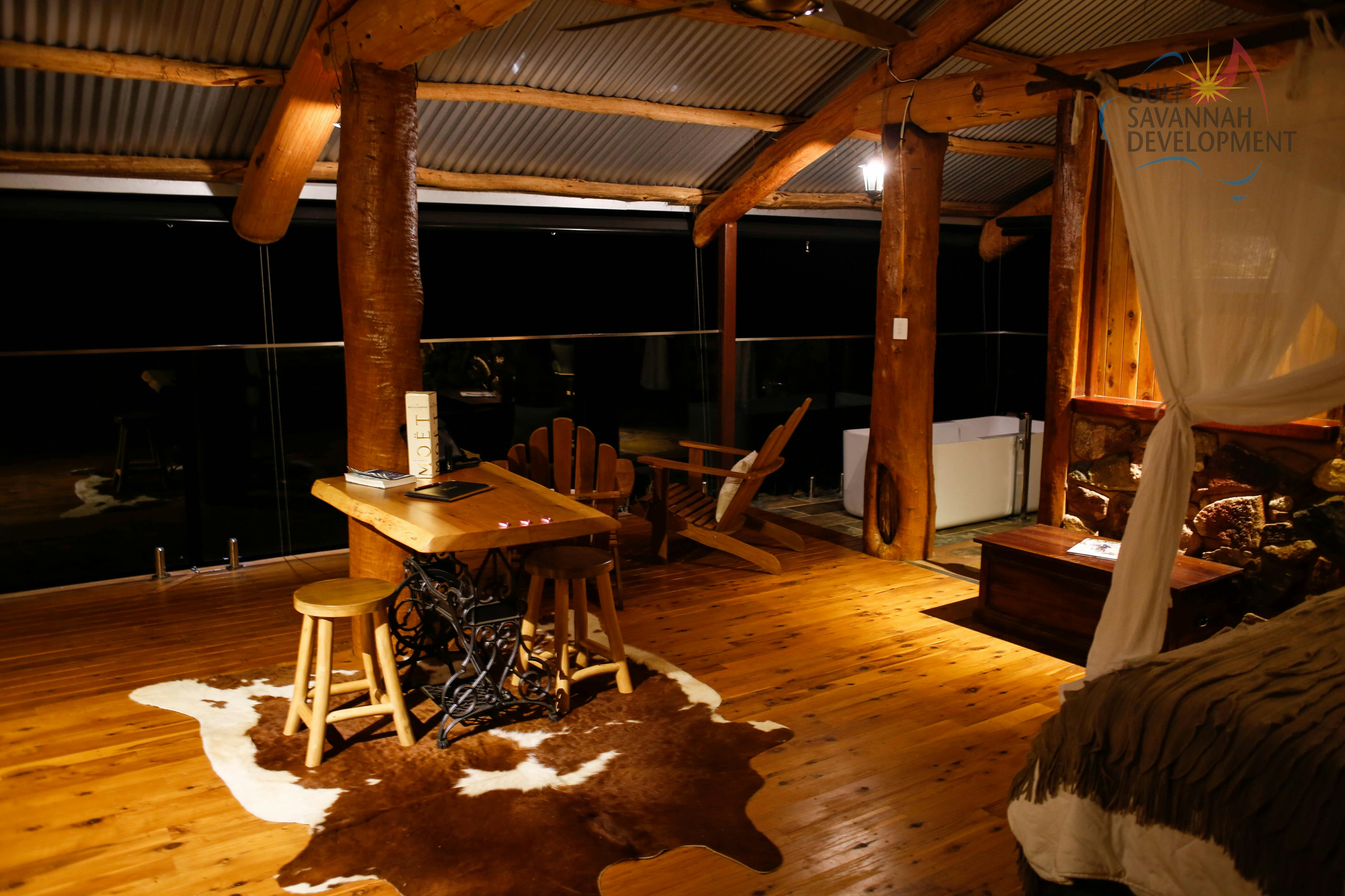 Night time image of the inside of 'The Hut' at Gilberton Outback Retreat