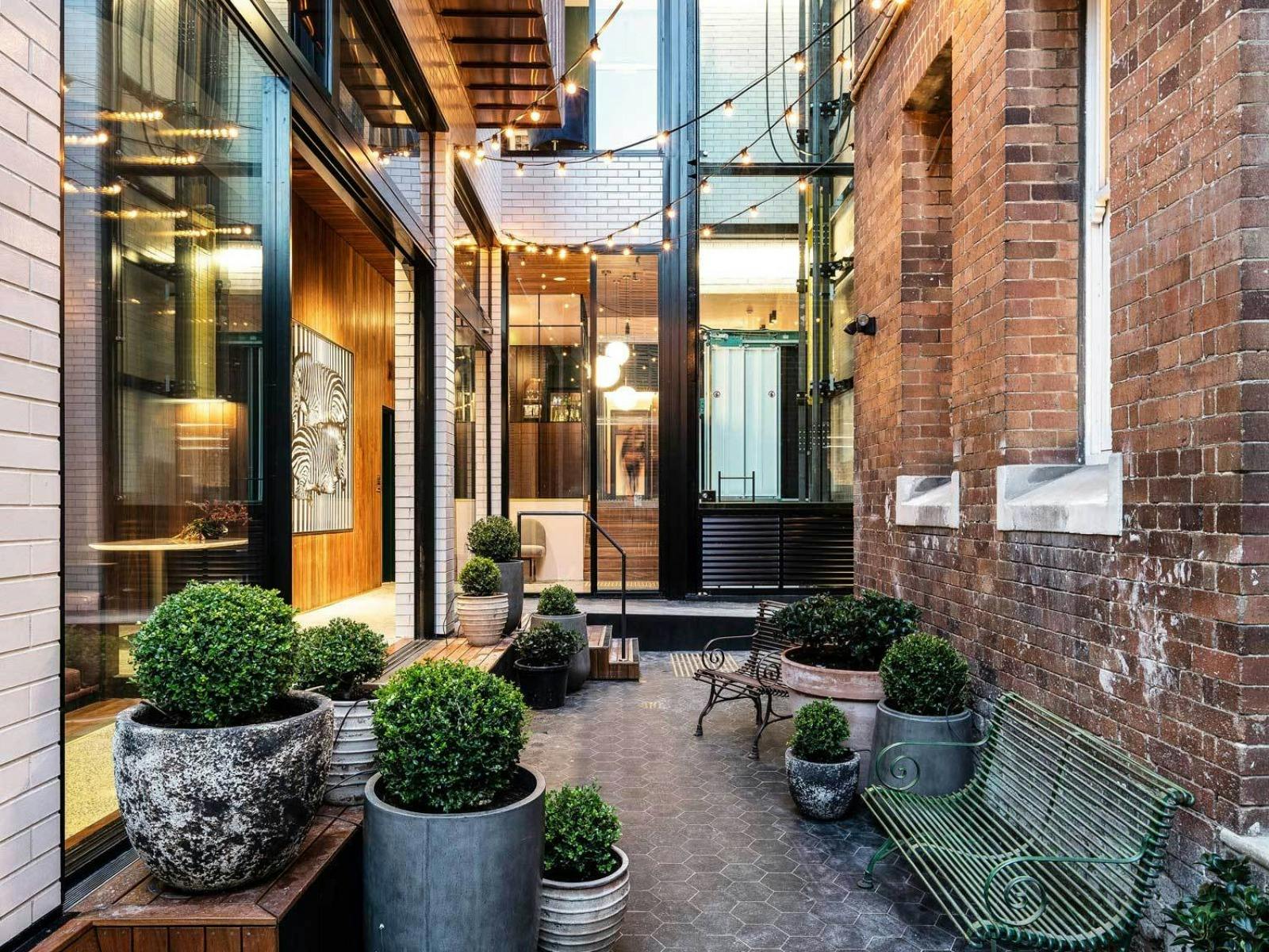 Crystalbrook Albion’s elegant courtyard blends heritage charm, greenery and boutique luxury