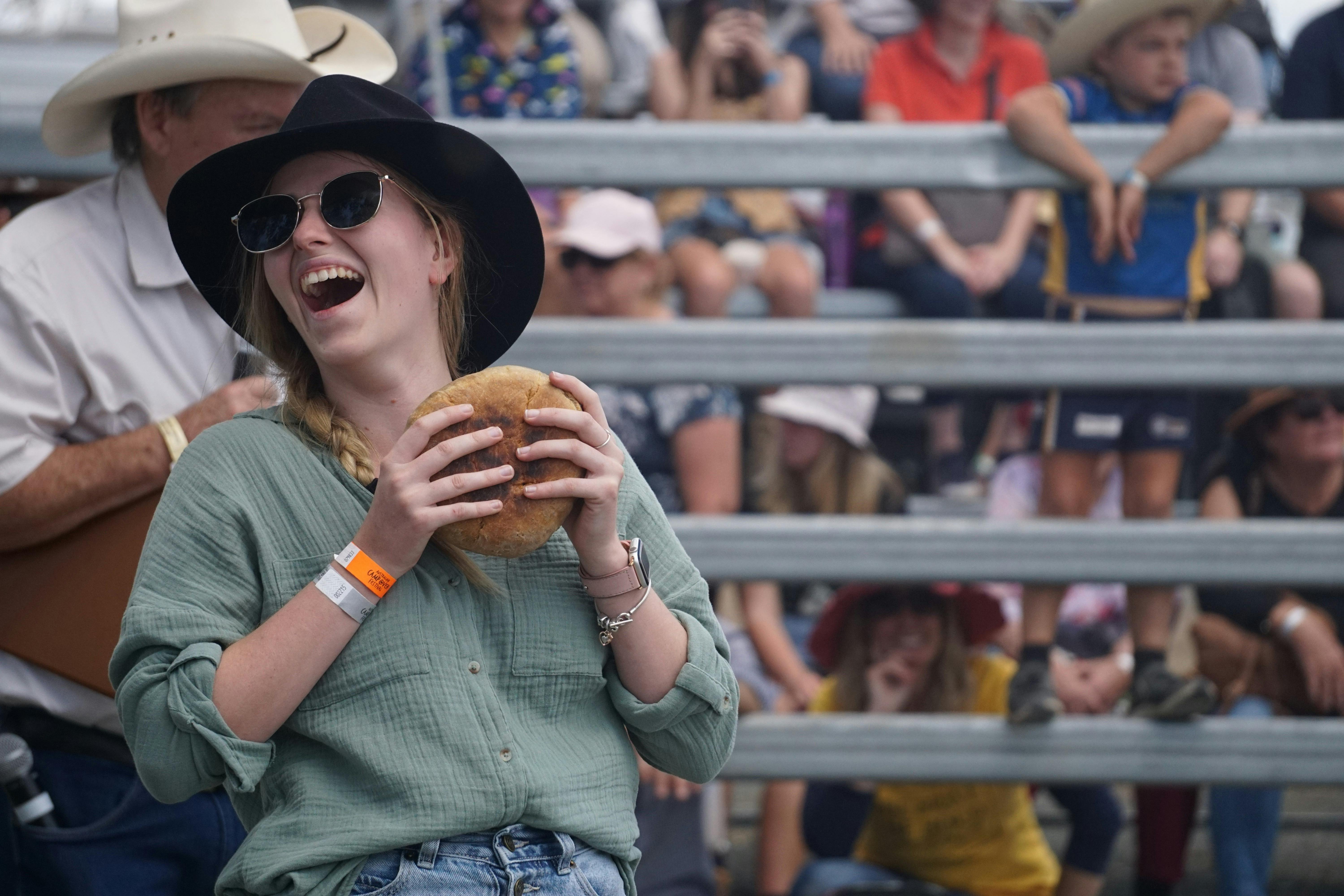 Lady having fun competing in the damper throwing competition