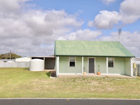 An authentic beach shack from the outside and a cozy, contemporary styled home from the inside.