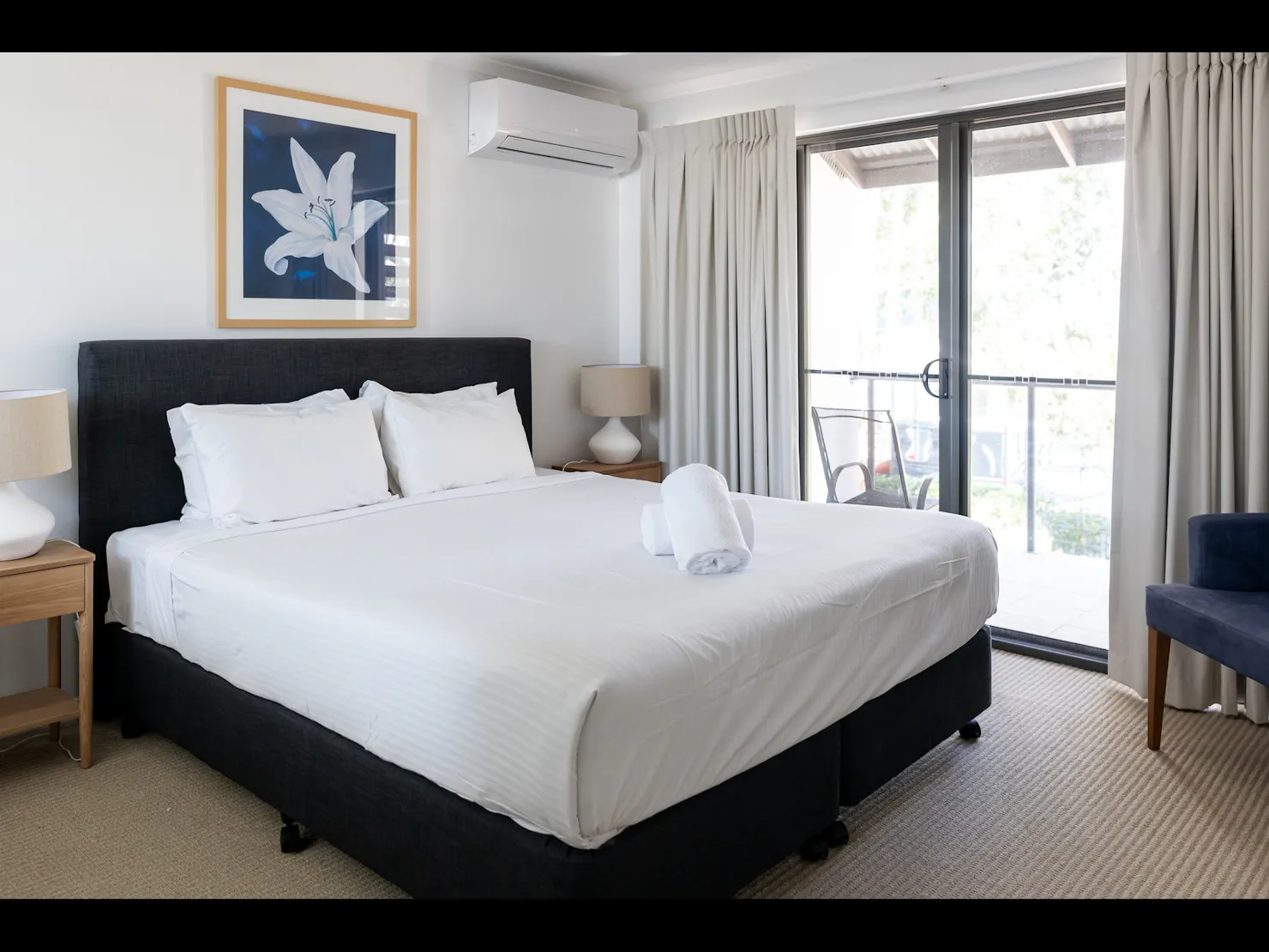 Large white bed in master bedroom