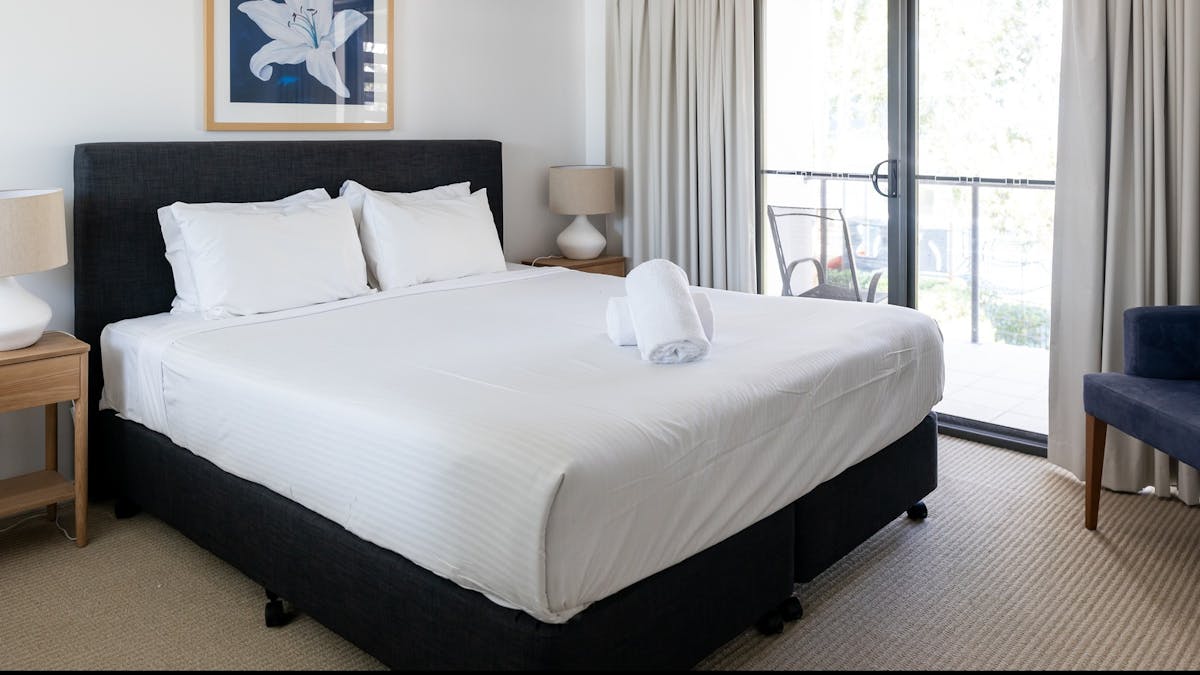 Large white bed in master bedroom